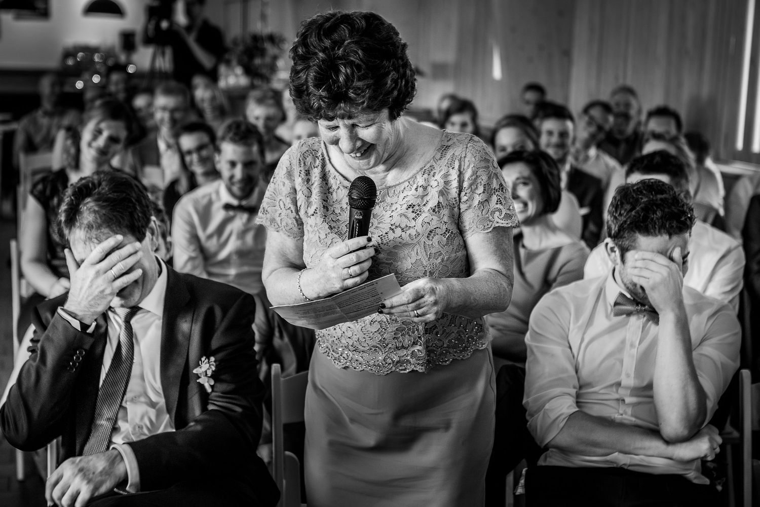 A black and white photo collage shows candid emotional moments during what appears to be a wedding celebration.