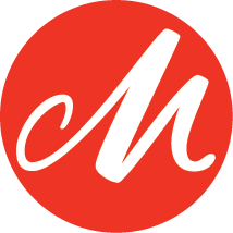 A close-up view of the iconic Coca-Cola logo in bright red against a white background.