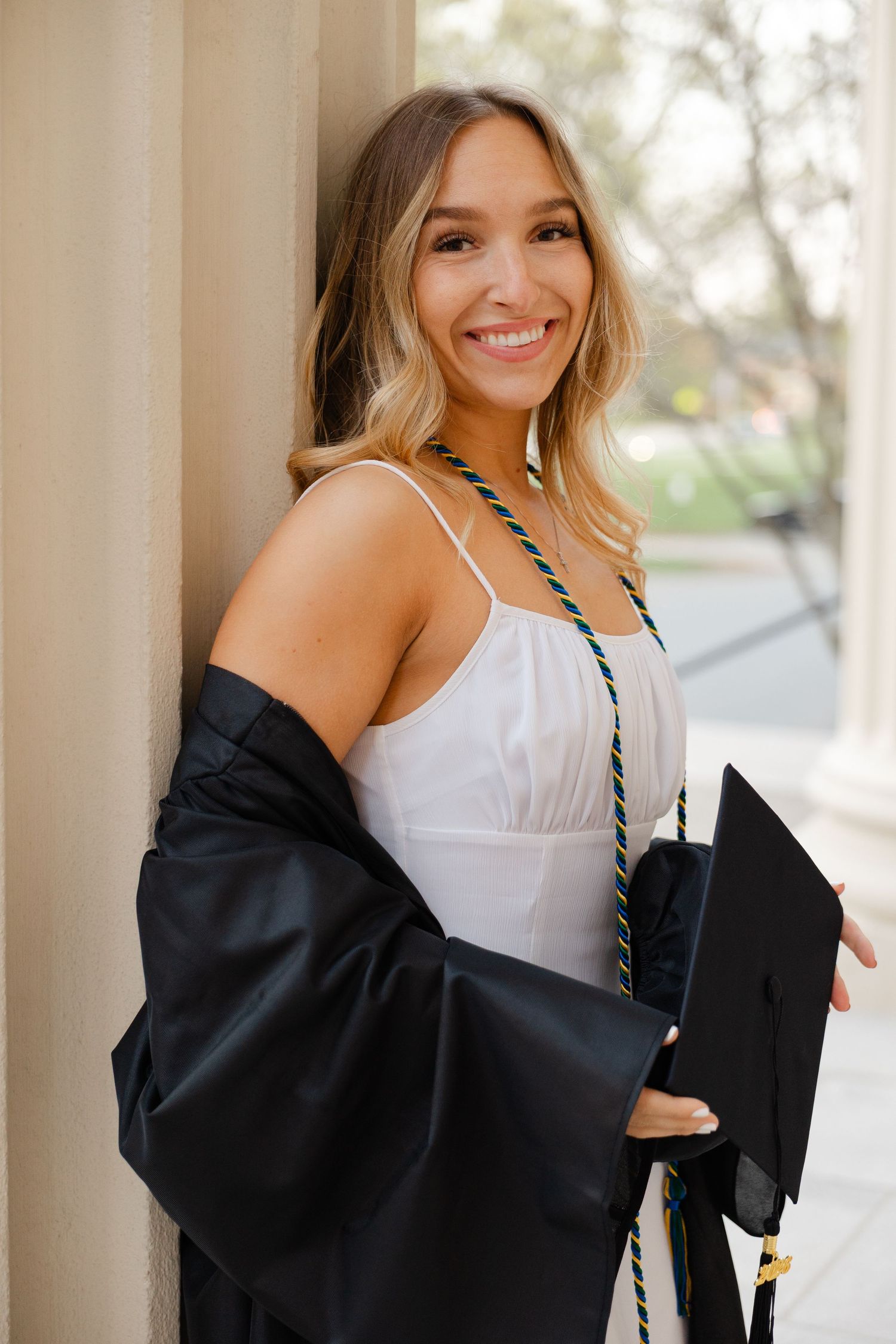 Senior graduation photography session in Massachusetts featuring natural light portraits and campus scenery.