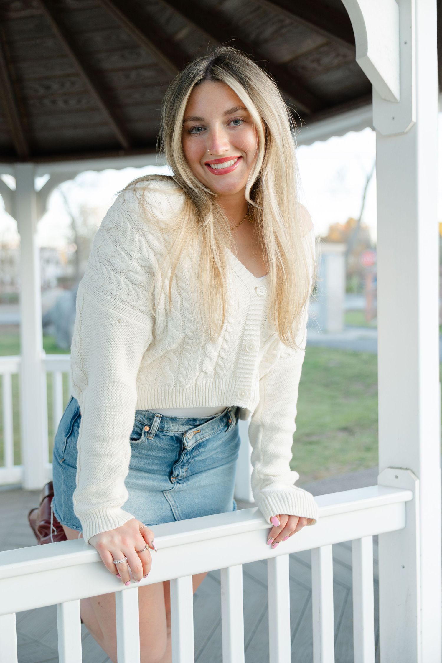 Lifestyle senior photography session in Massachusetts with candid outdoor portraits during golden hour.