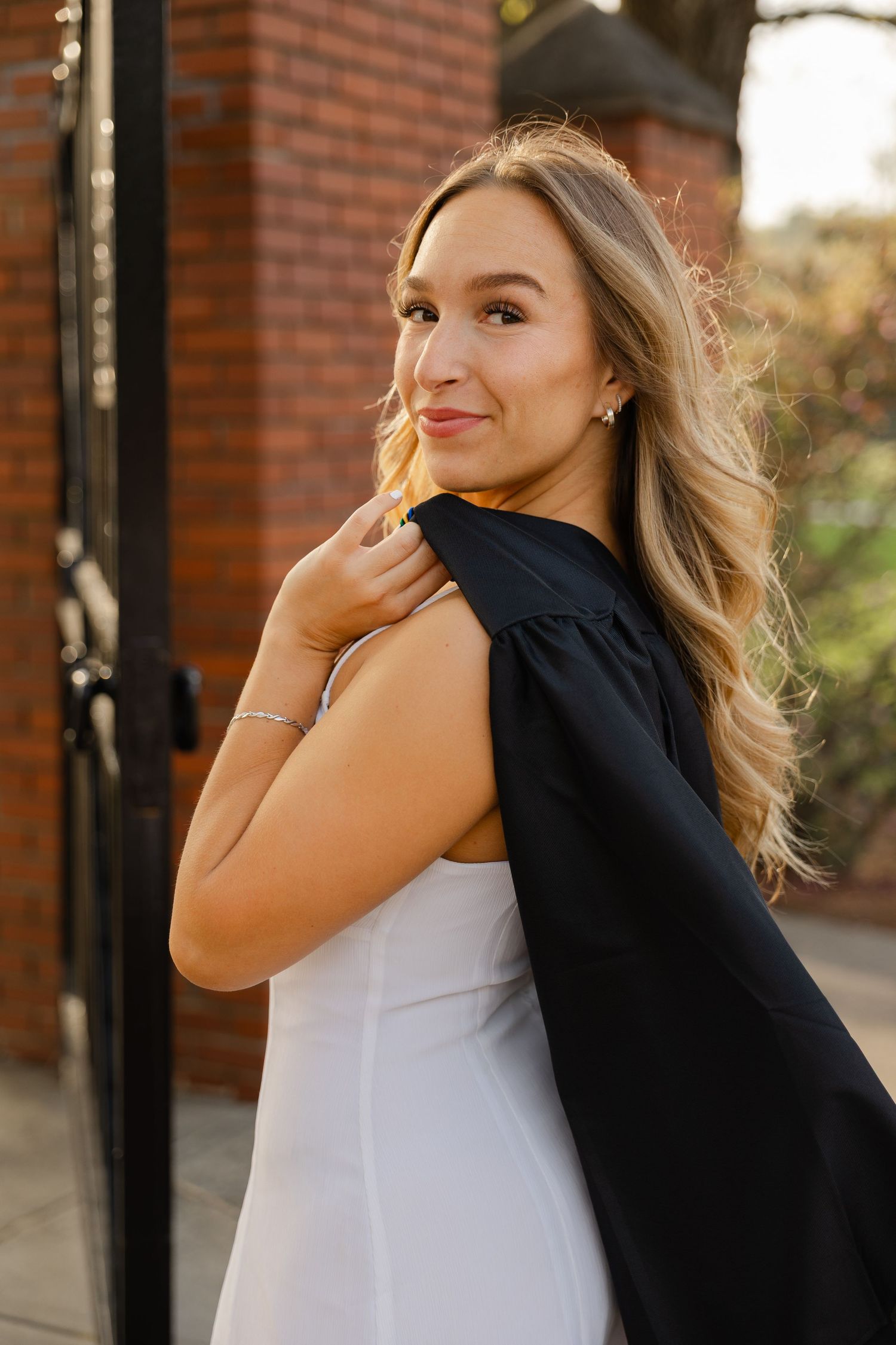 Senior graduation photography session in Massachusetts featuring natural light portraits and campus scenery.