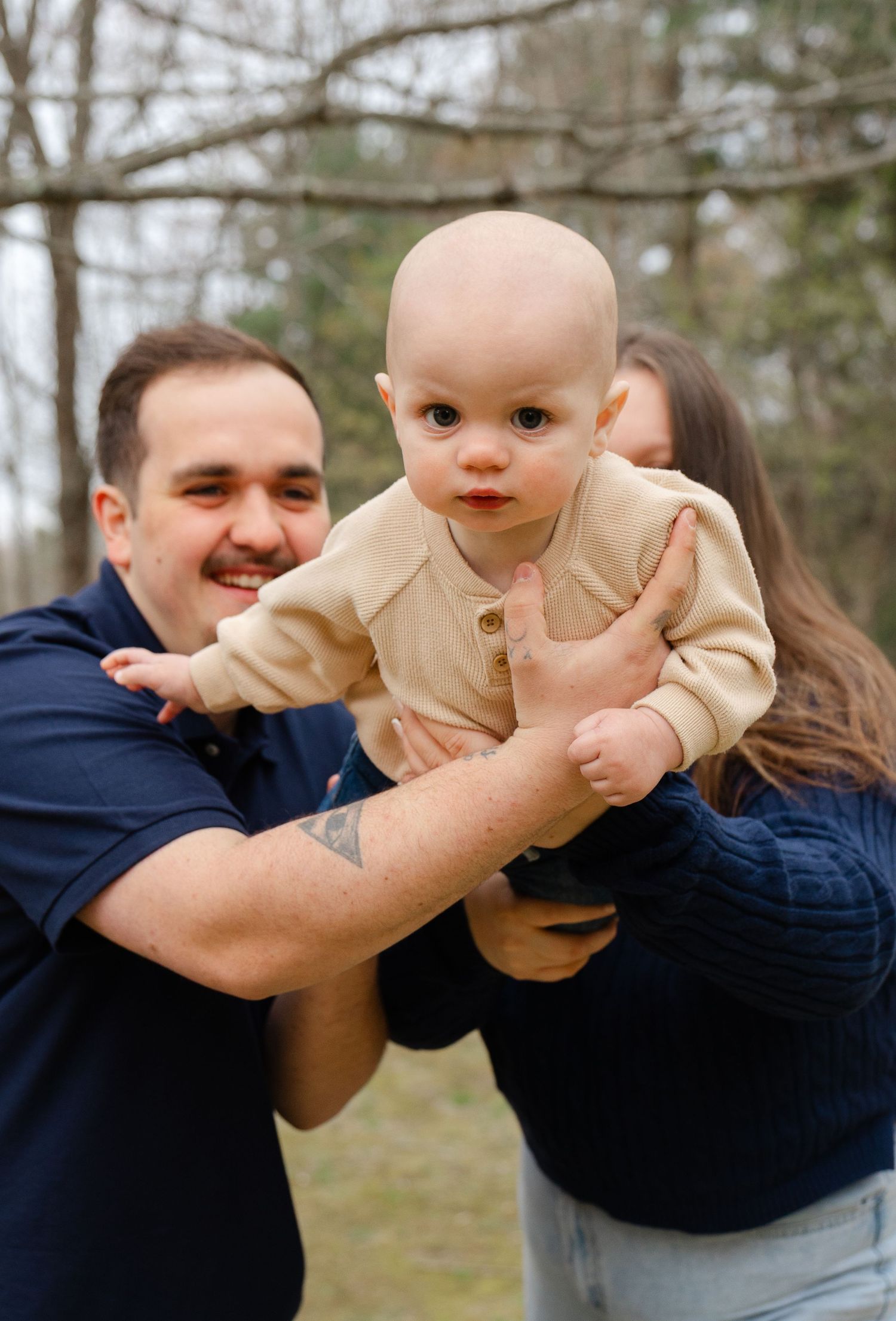 Outdoor family photography session in Massachusetts capturing candid moments with natural light and lifestyle posing.