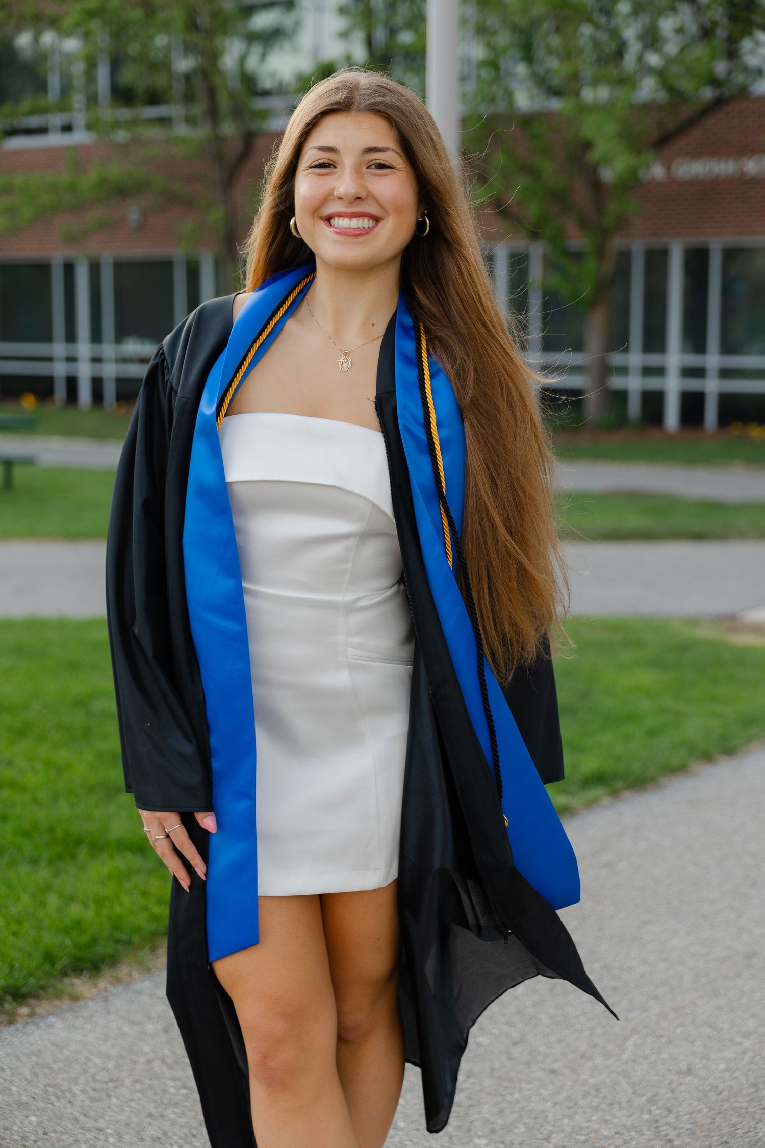 Senior graduation photography session in Massachusetts featuring natural light portraits and campus scenery.