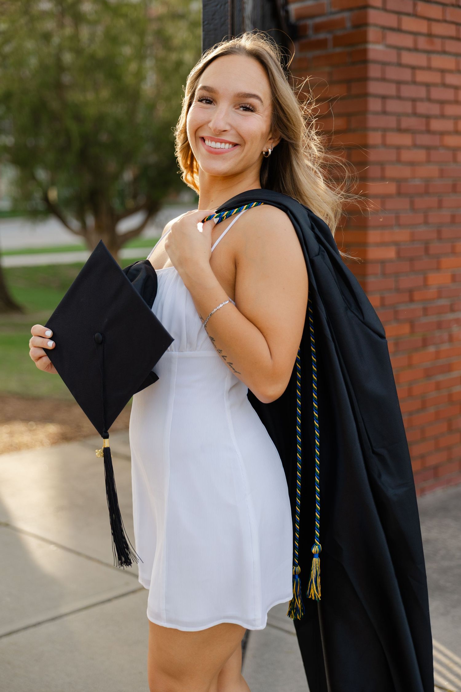 College senior graduation photos in Massachusetts with natural light and candid portrait styling.
