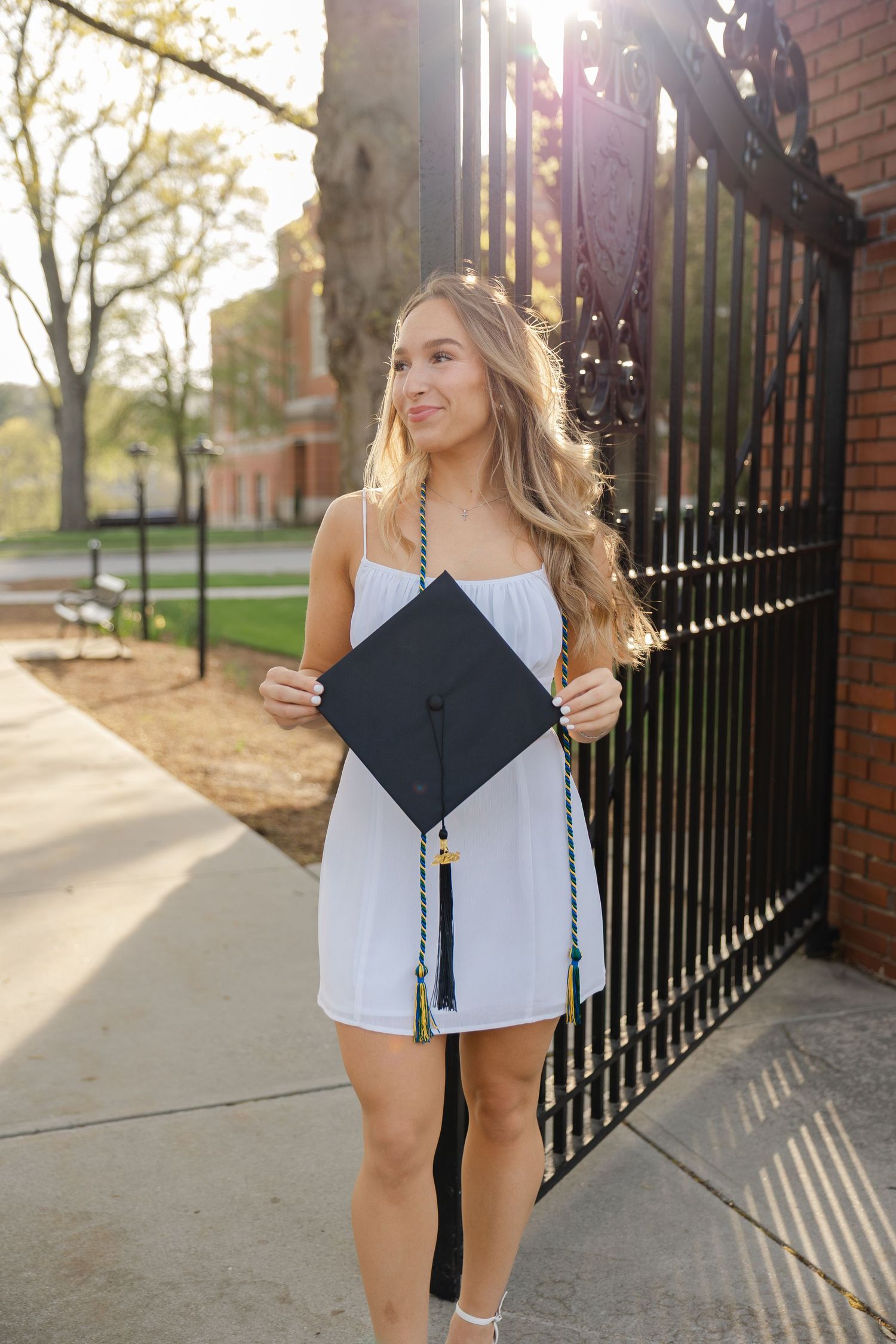 Senior graduation photography session in Massachusetts featuring natural light portraits and campus scenery.