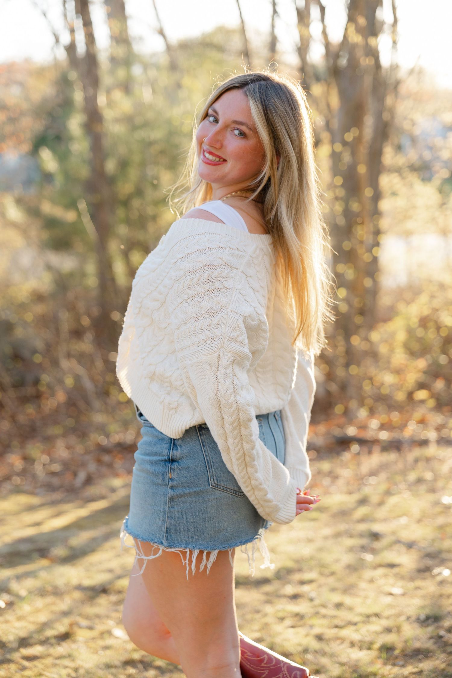 Lifestyle senior photography session in Massachusetts with candid outdoor portraits during golden hour.