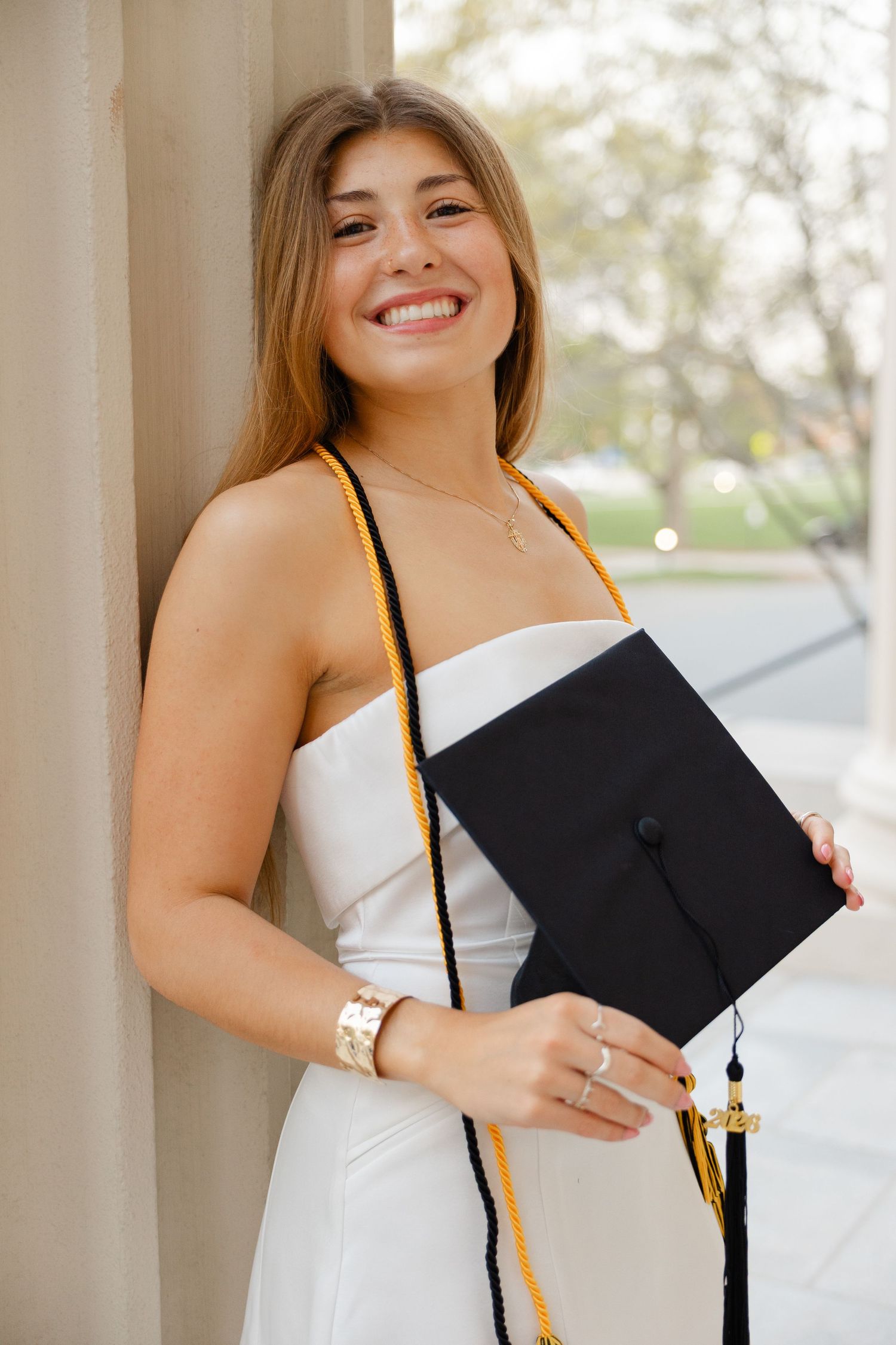 Senior graduation photography session in Massachusetts featuring natural light portraits and campus scenery.