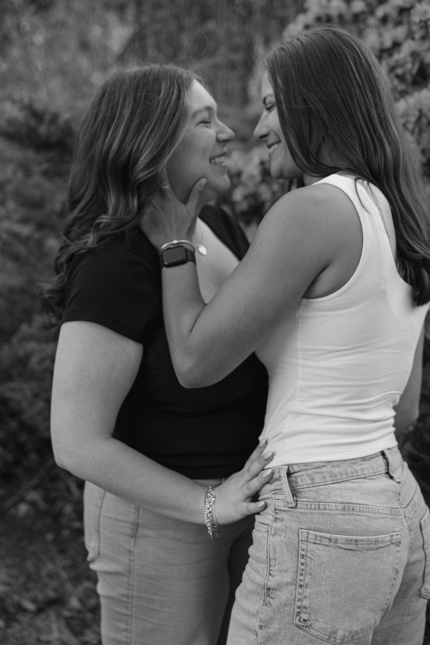 Outdoor couples photography session in Massachusetts capturing playful candid moments with natural light.