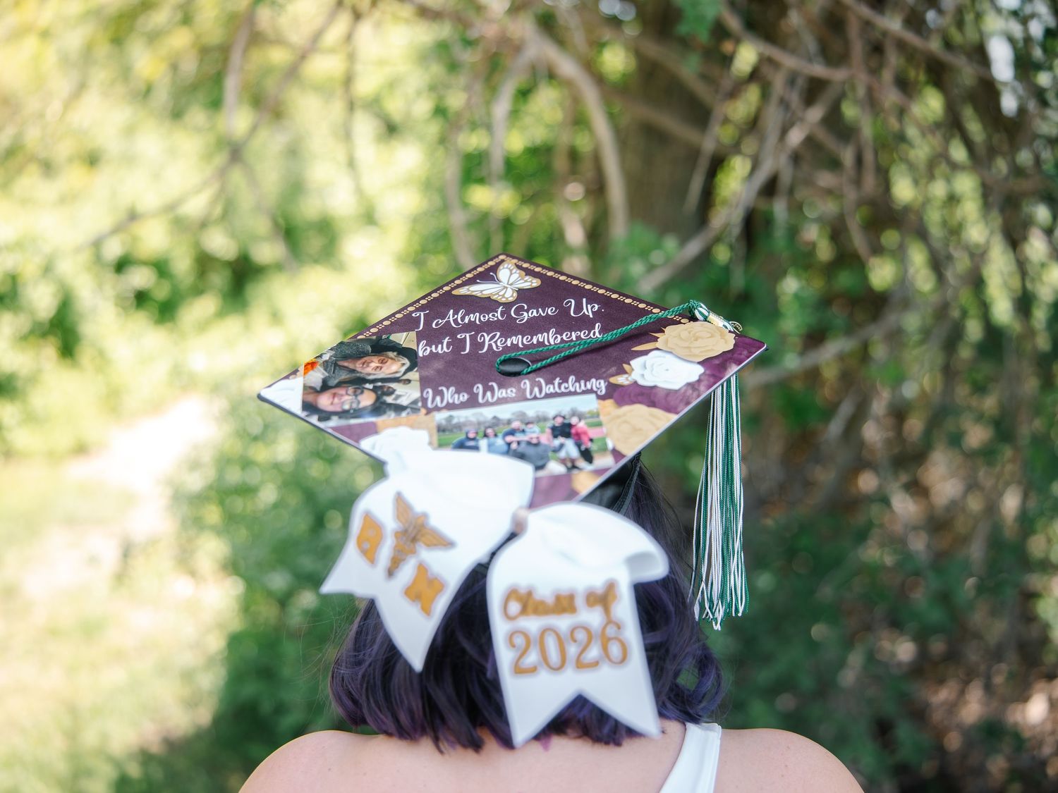 Decorated graduation cap reading I Almost Gave Up But I Remembered with Class of 2026 bow.