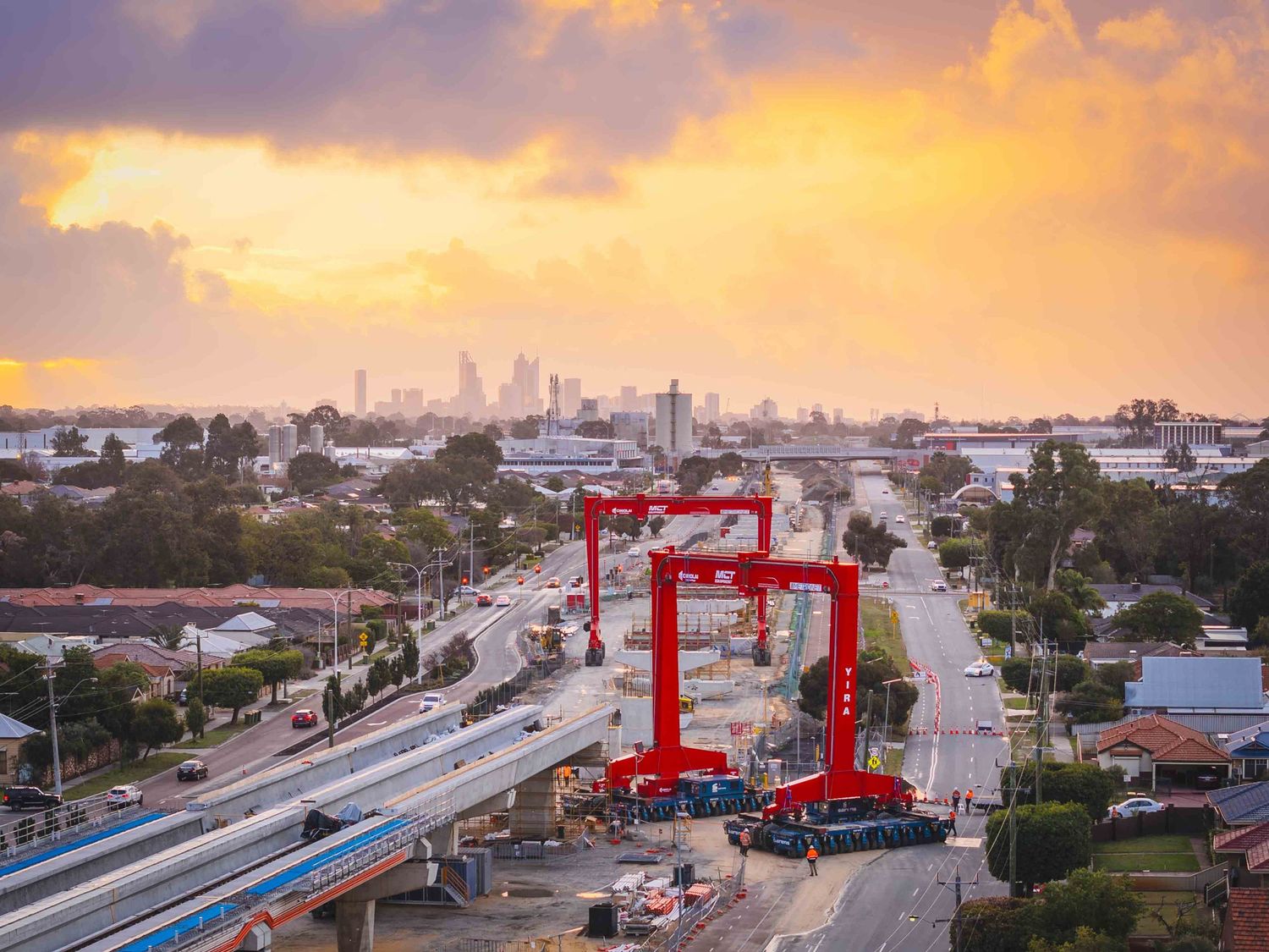 Drone picture of construction of elevated rail way at sunset in Perth, Western Australia