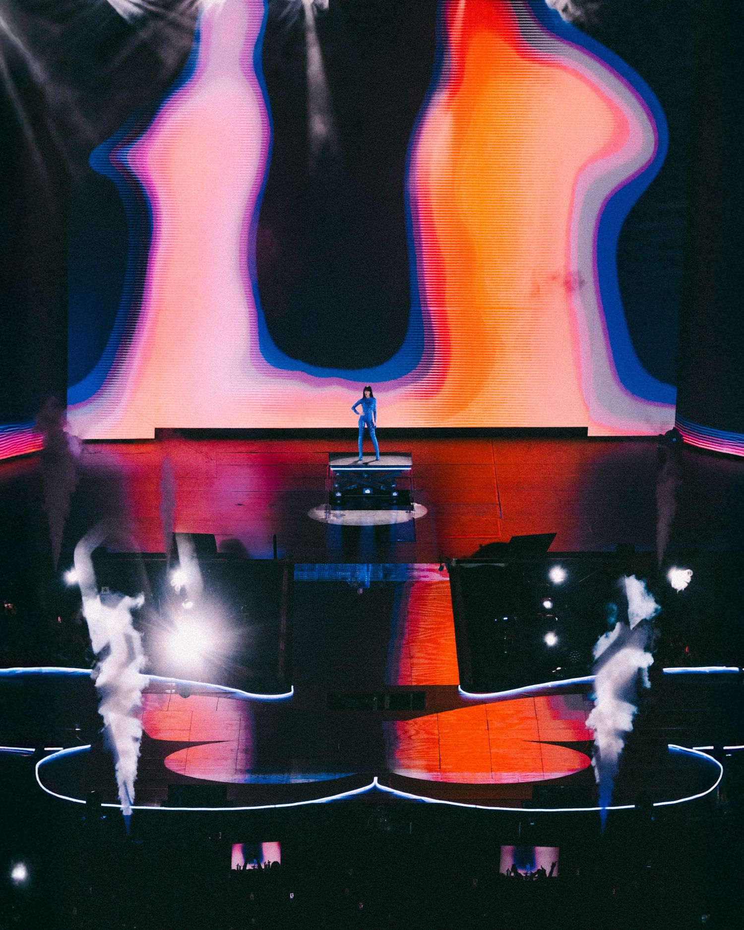 Abstract silhouettes dance against vibrant pink and orange gradient backgrounds in a series of experimental photographs.
