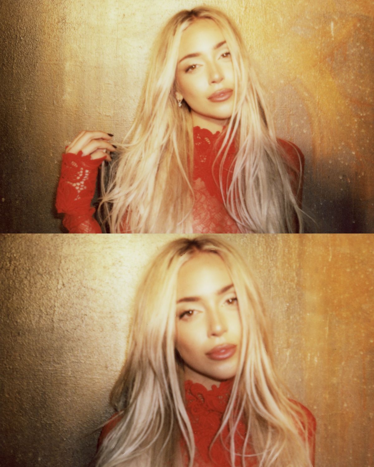A person with long platinum blonde hair poses in a red top against a warm textured background.