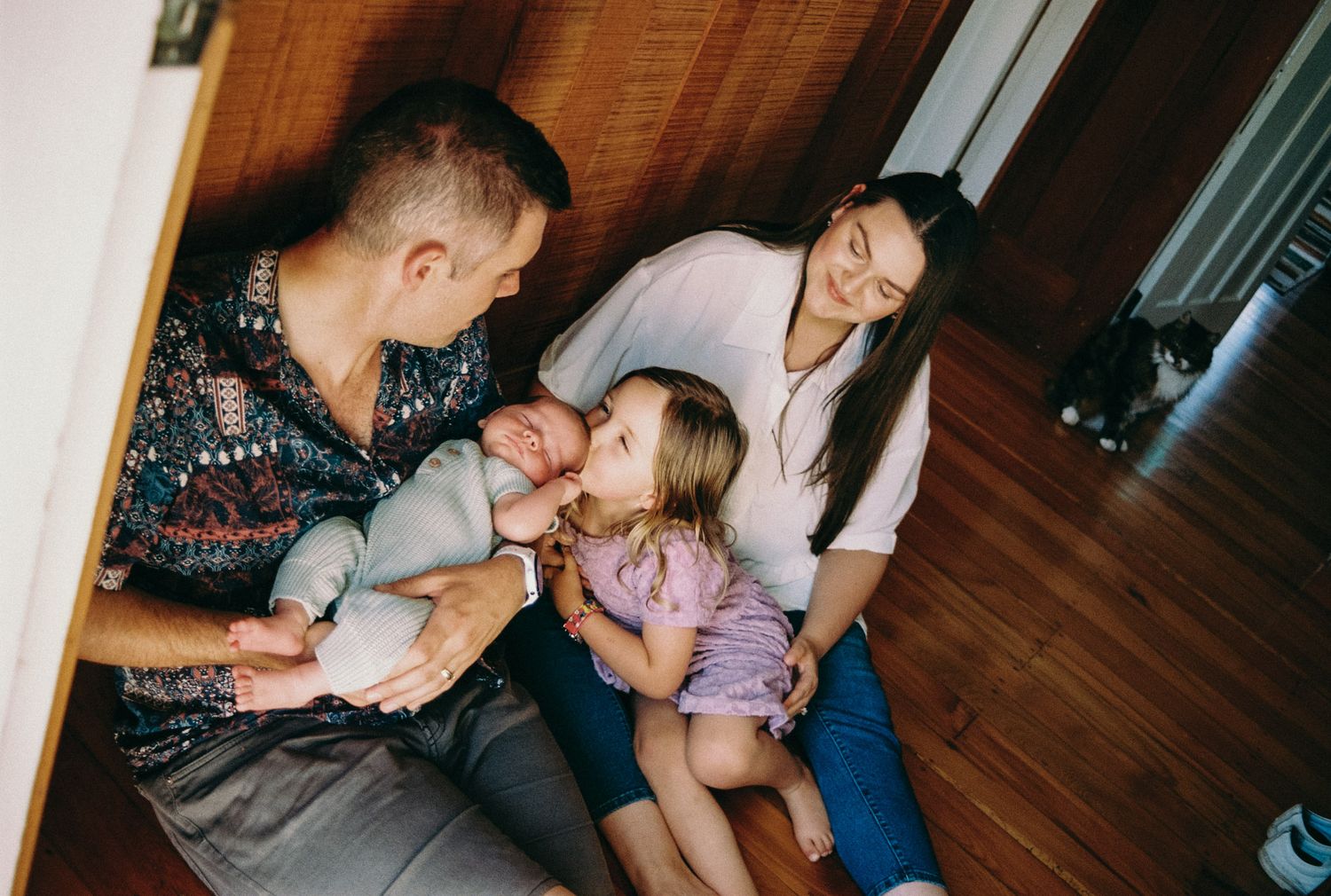 Family spending quality time together and sharing affectionate moments on a cozy couch at home.