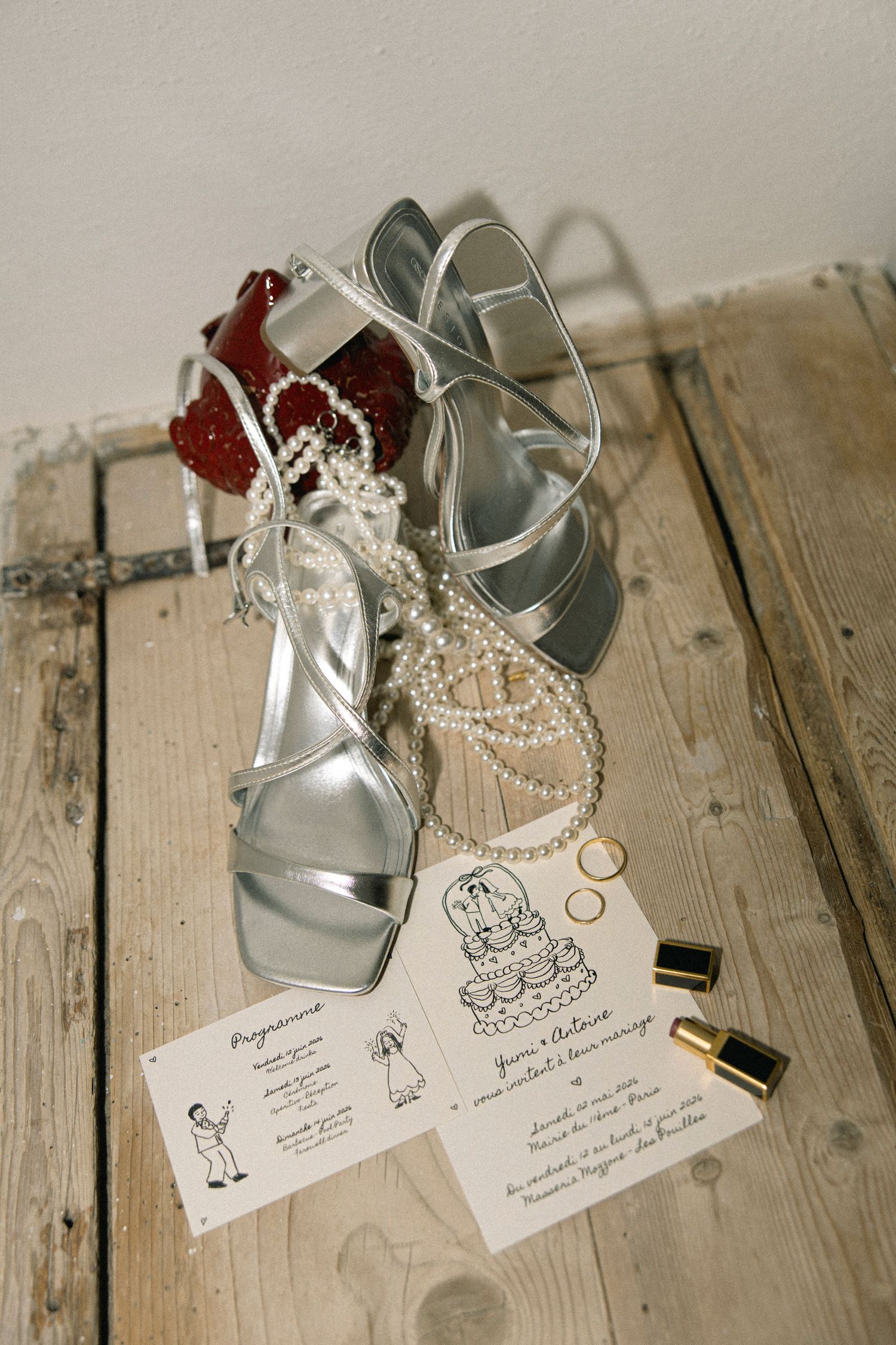 Fashion wedding details featuring shoes, jewelry, lipstick, invitations and stylish accessories photographed with a refined aesthetic