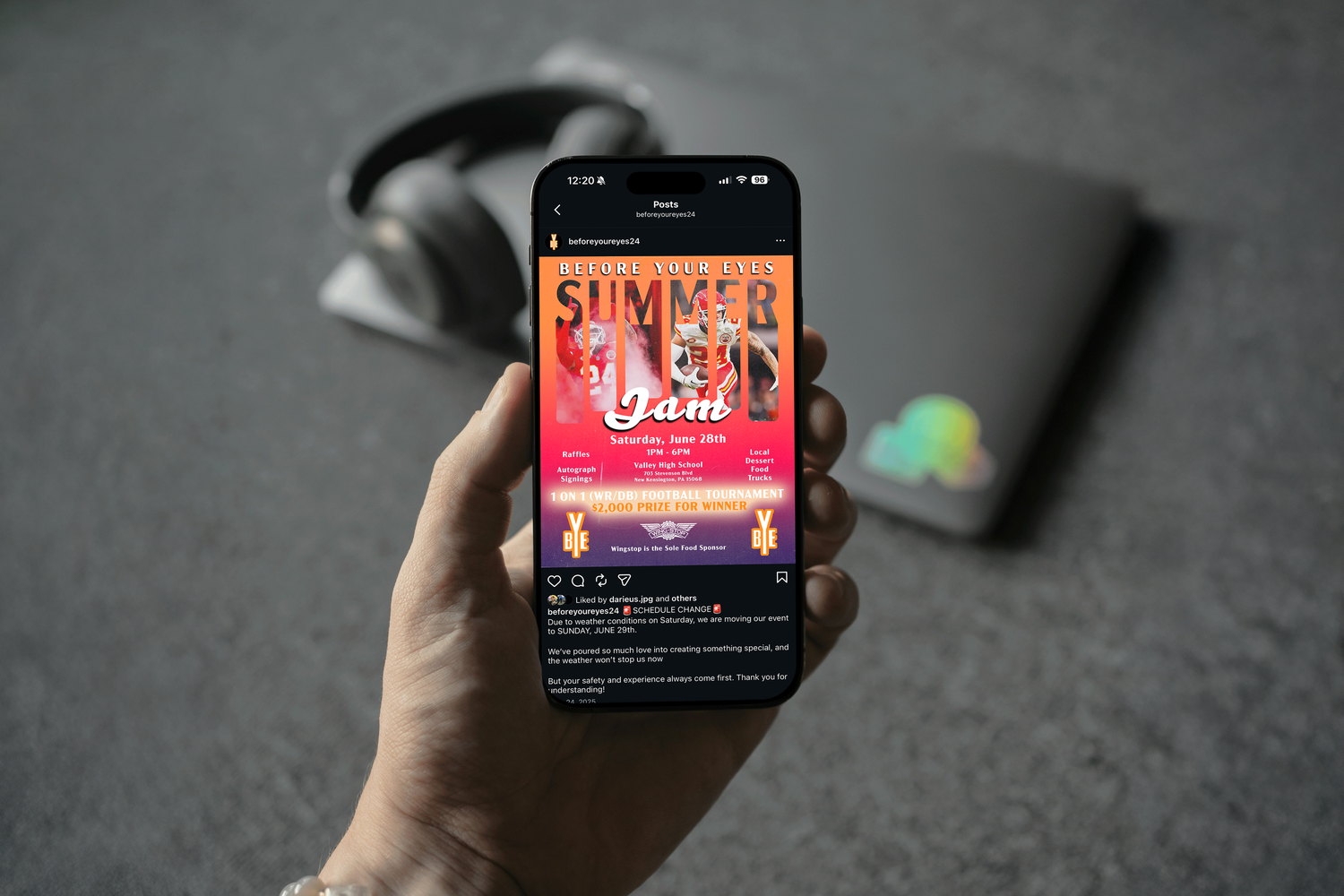 Hand holding iPhone displaying 'Summer Vibes' event screen with orange sunset gradient background on music app interface.