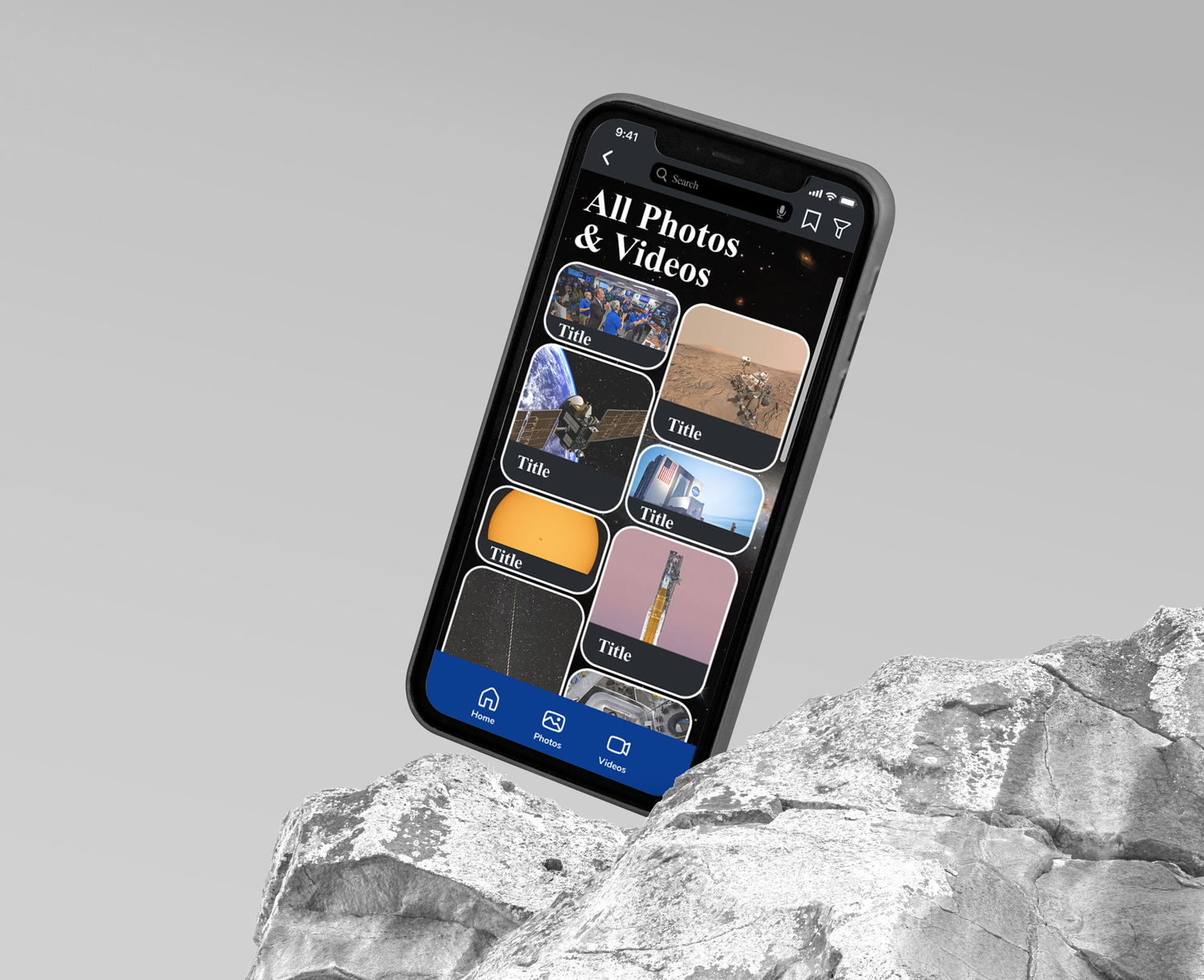 A smartphone displaying a photo gallery app rests on a white marble or stone surface.