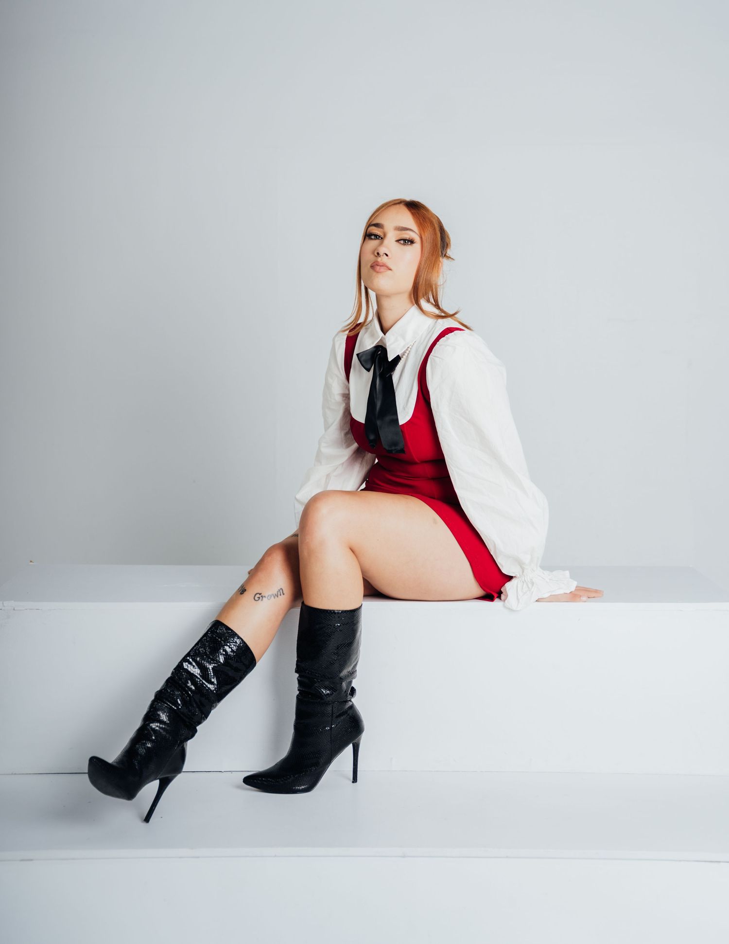 Fashion photography series featuring red outfit and black boots against white background.