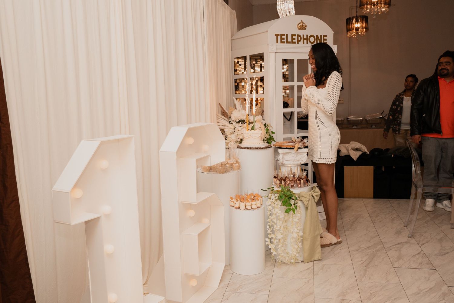 A party space with large white numbers and decorative elements on display.
