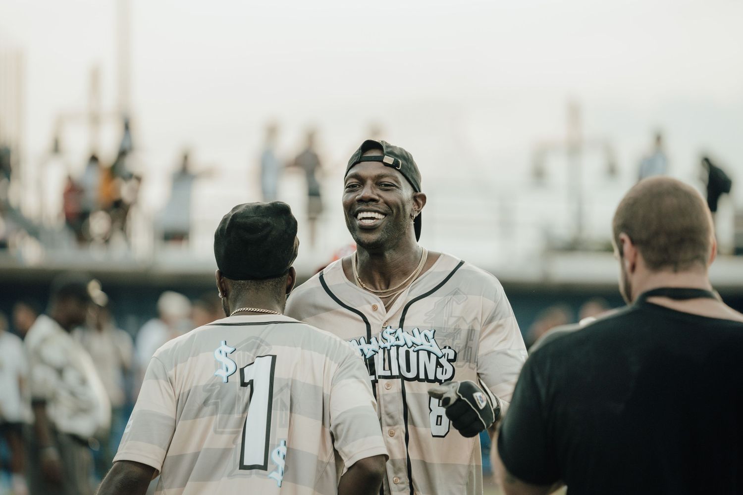 Black and white vintage baseball photo showing teammates celebrating together after a victory.