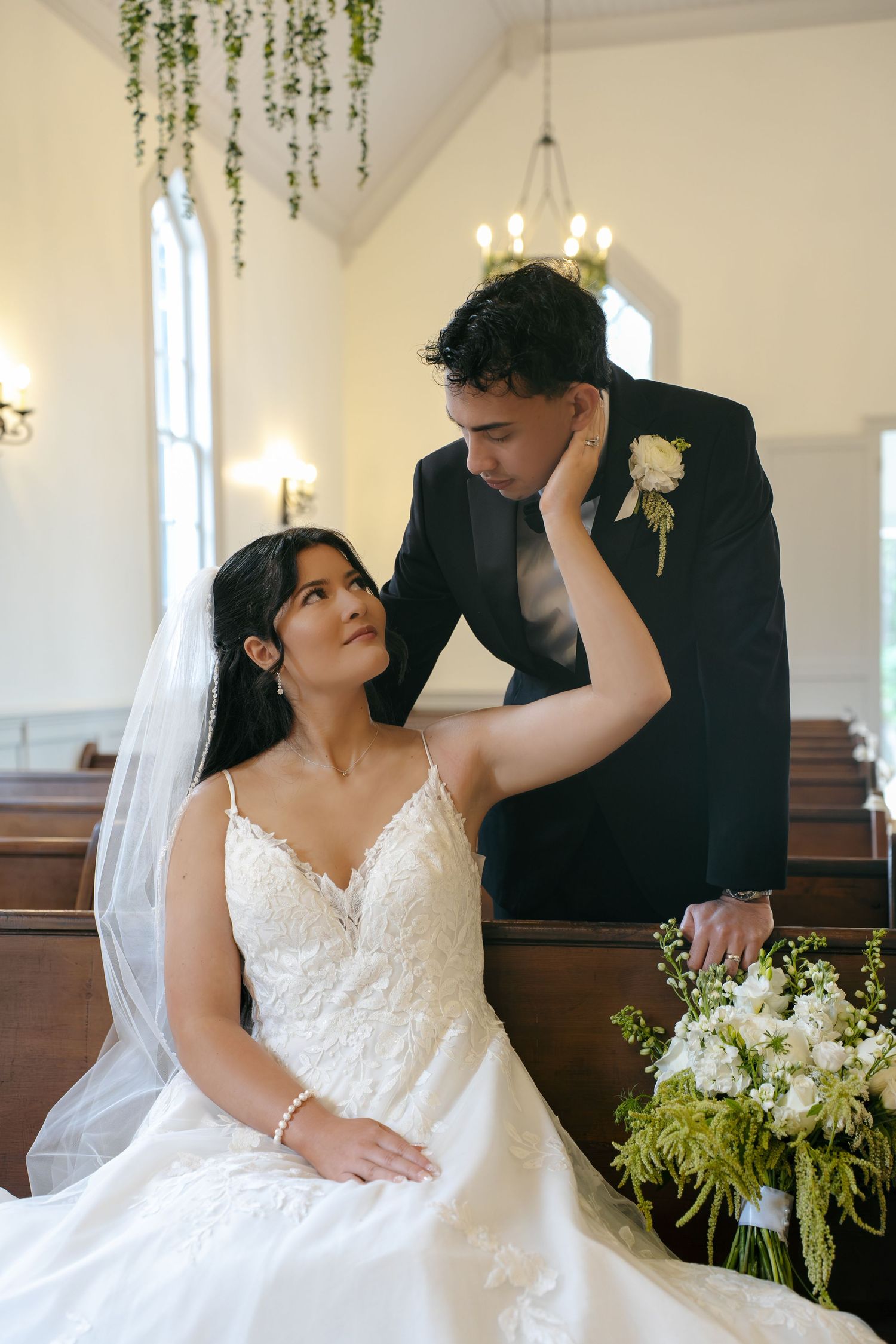 pictures of bride and groom taken in a modern unique chapel in Virginia with bouquet