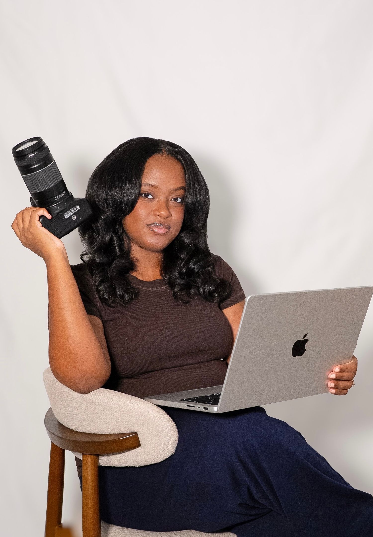 Maryland and Washington, DC portrait and wedding photographer holding her camera.