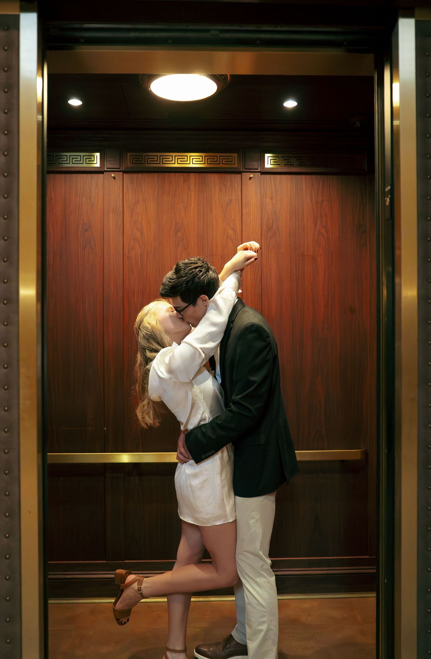 Editorial couples photography inside an elevator at the National Gallery of Art in Washington, DC.