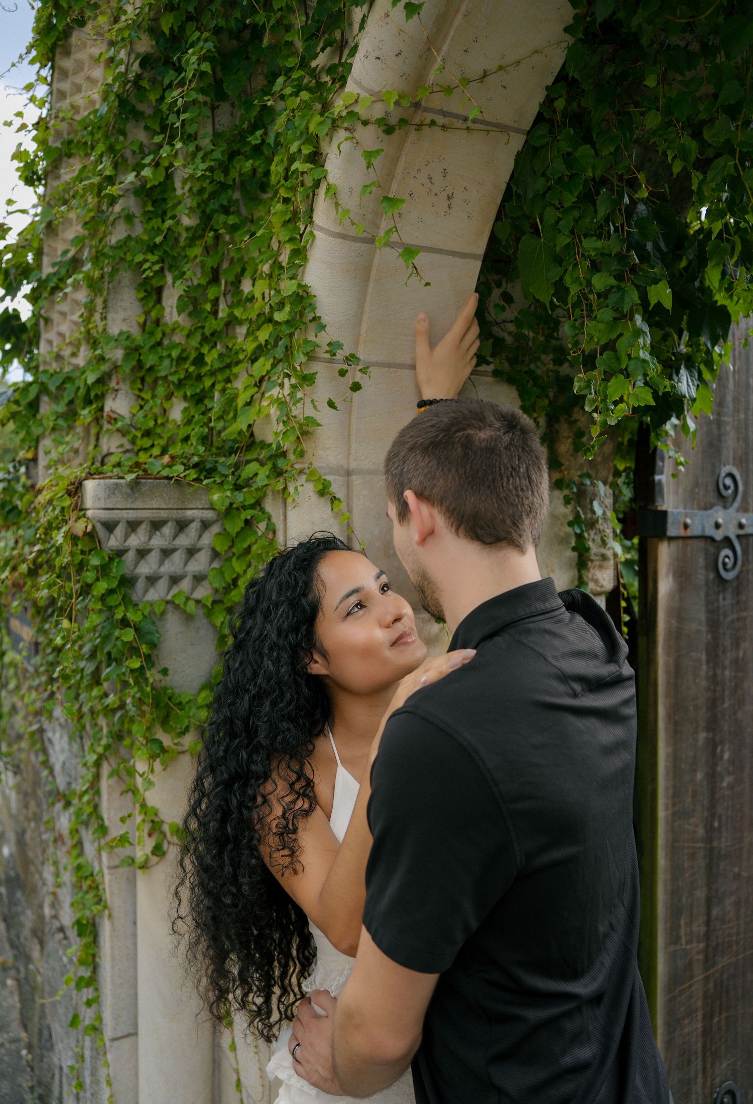 Couple sharing a romantic moment during a photography session at Washington National Cathedral in Washington, DC.