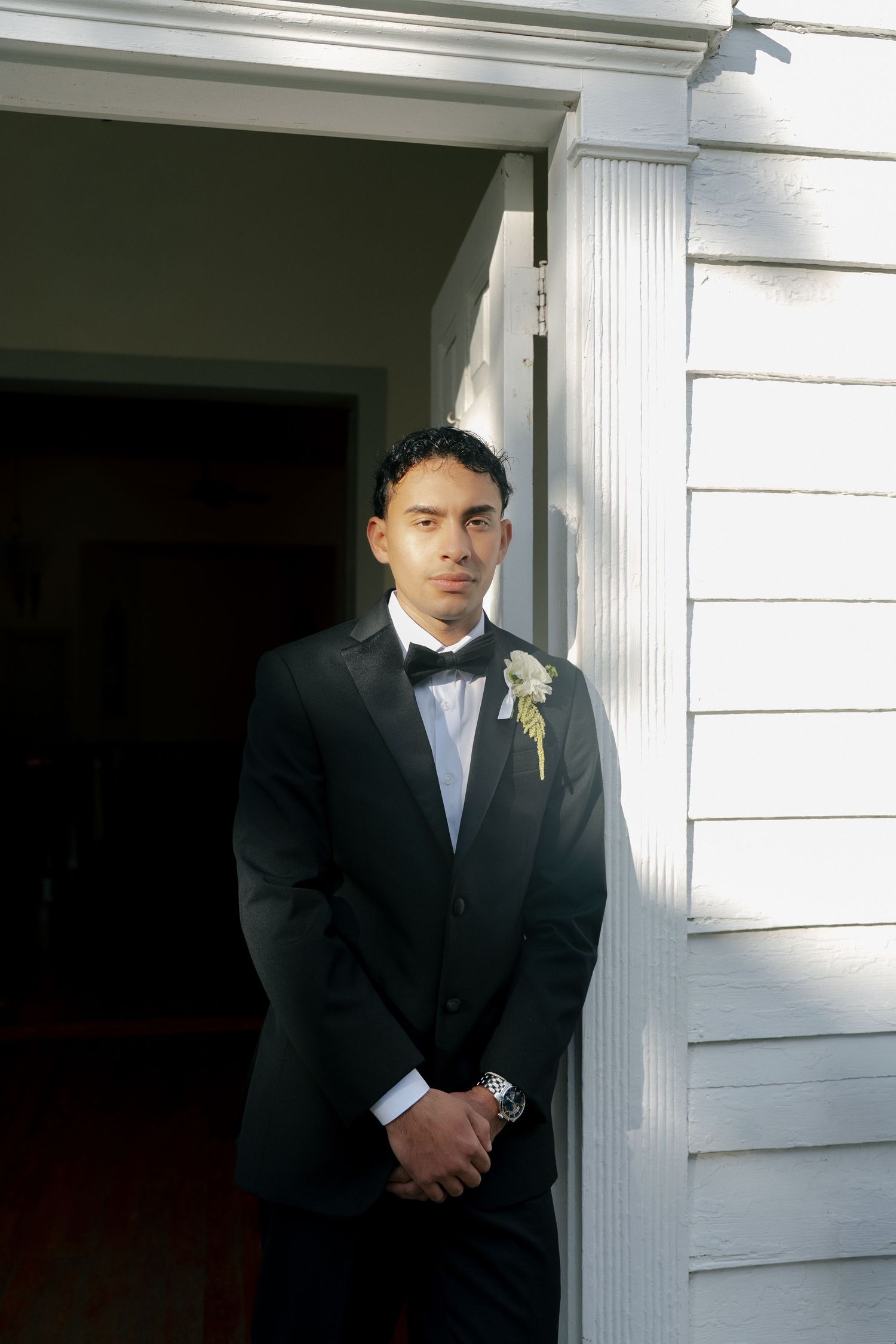 intimate and vintage looking picture of groom on his wedding day