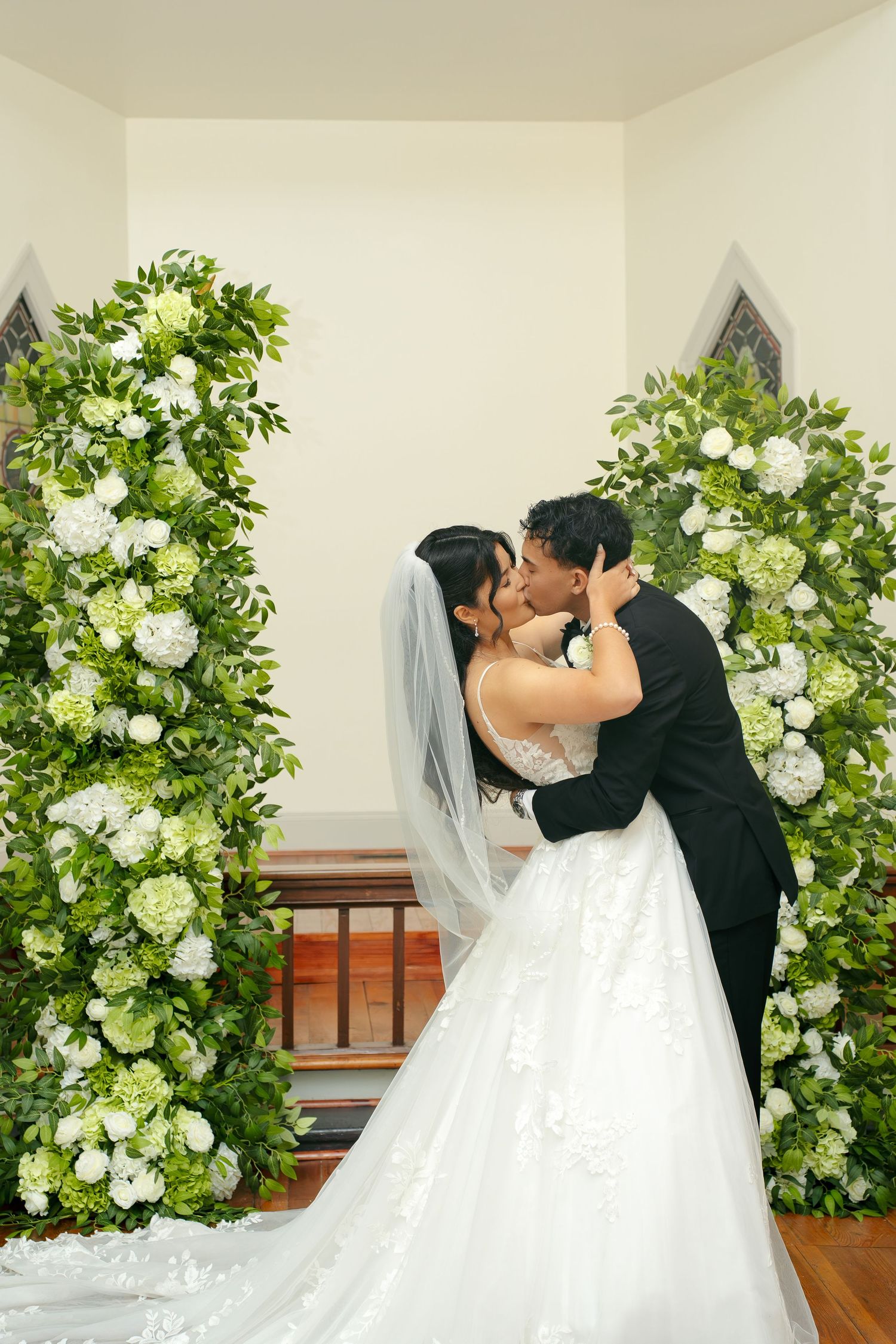 First kiss as bride and groom captured by DMV based photographer FebenCollective