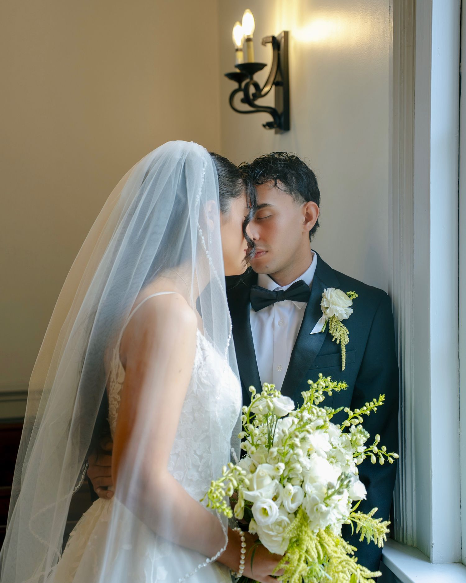 Bride and groom gazing at each other during a romantic wedding portrait session in Maryland.