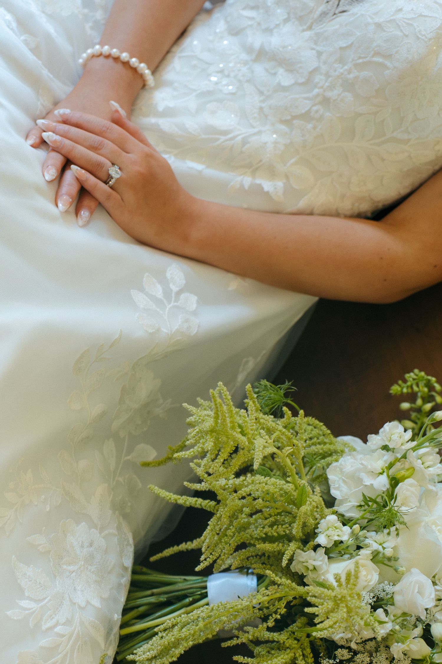 close up detail of bride's rings and bouquet during her intimate wedding day