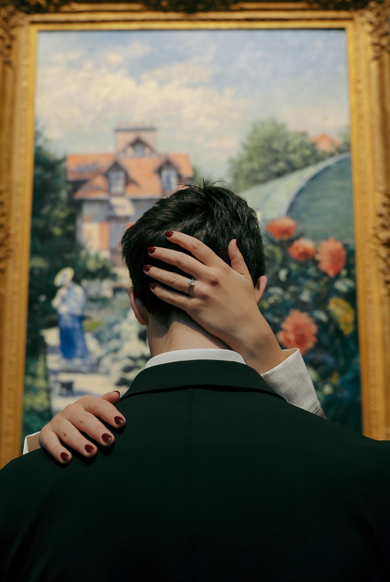 Editorial engagement portrait of a couple surrounded by artwork at the National Gallery of Art in DC.