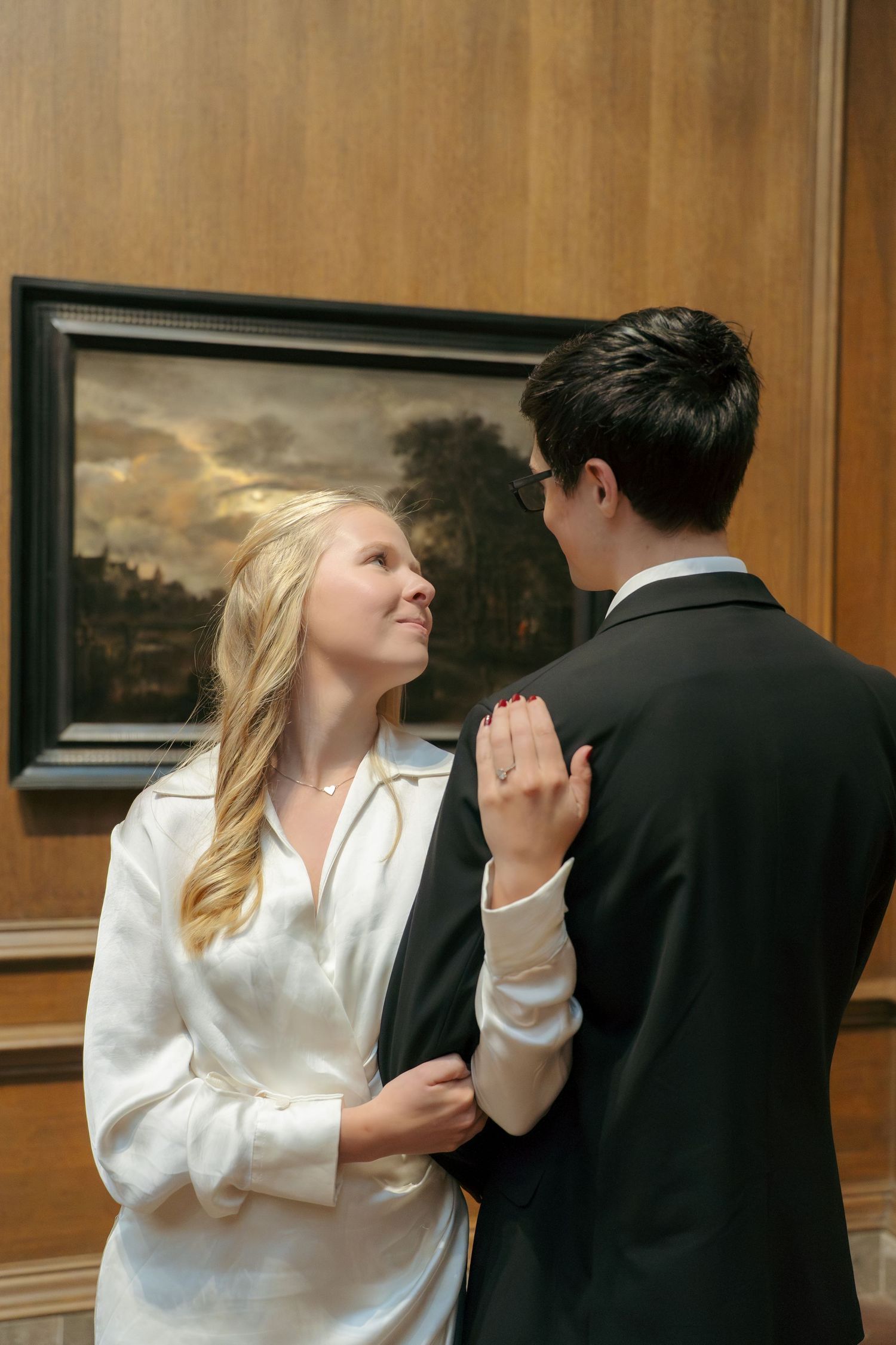 Couple sharing a romantic moment during an engagement photography session at the national art museum in Washington DC