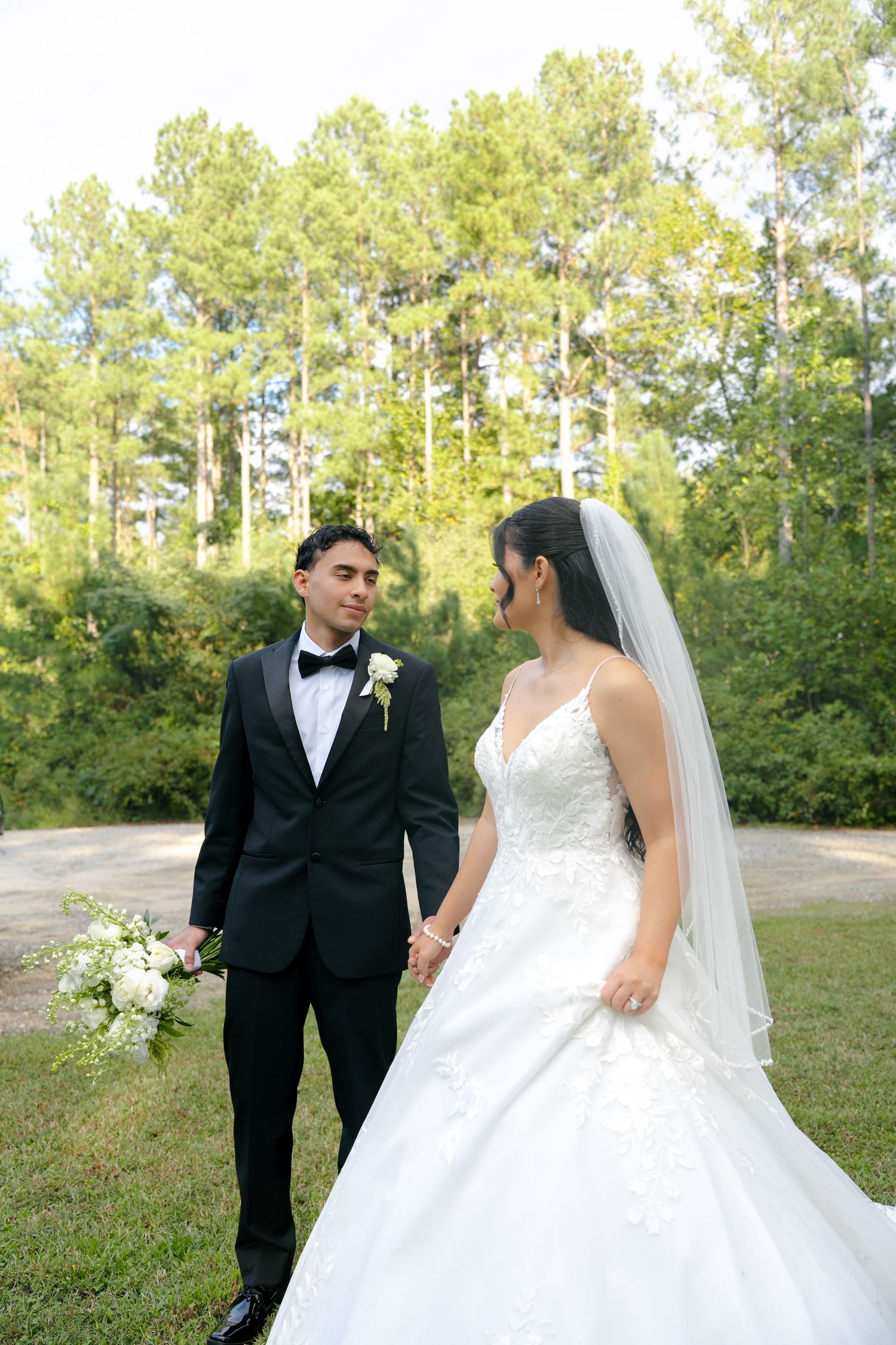 Candid wedding reception photo of newlyweds celebrating before walking down the aisle