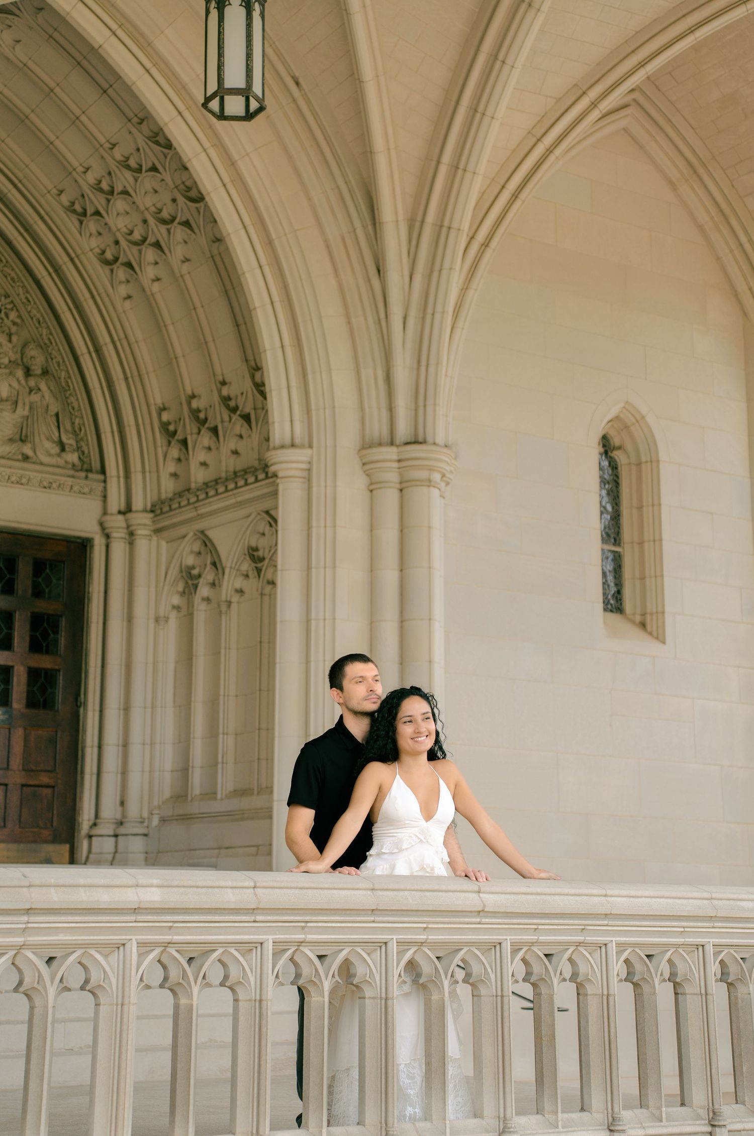 Elegant couple portrait photographed against the Gothic architecture of Washington National Cathedral in Washington, DC.
Couple holding hand