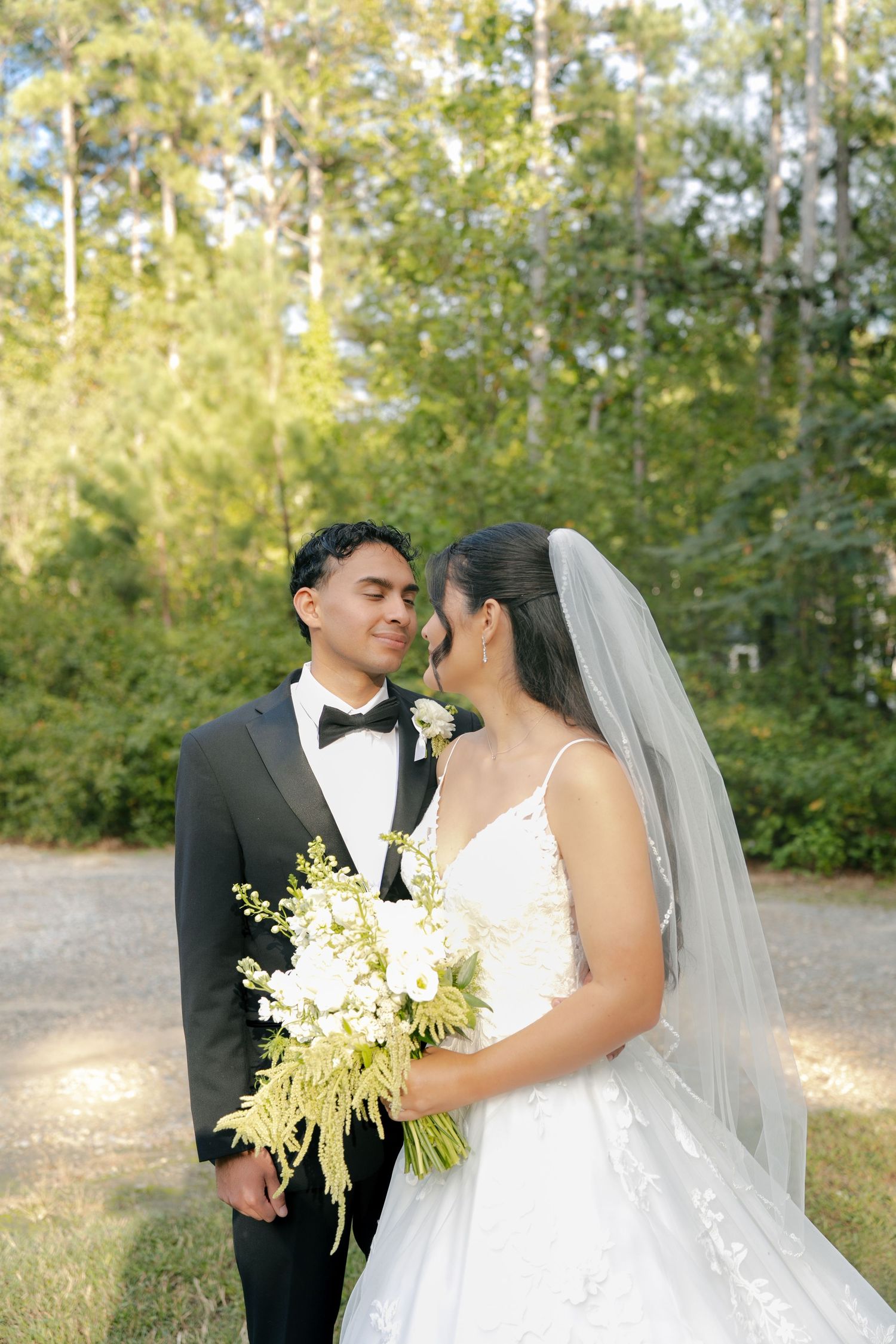 bride and groom looking into each other's eyes during their portraits on the wedding day in Virginia