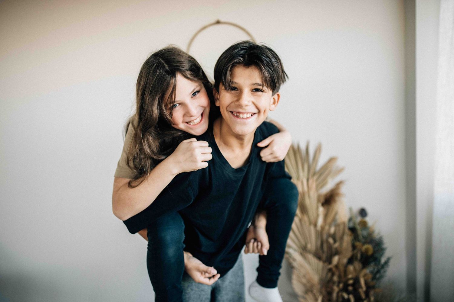 Indoor lifestyle portrait with warm lighting and natural decor.