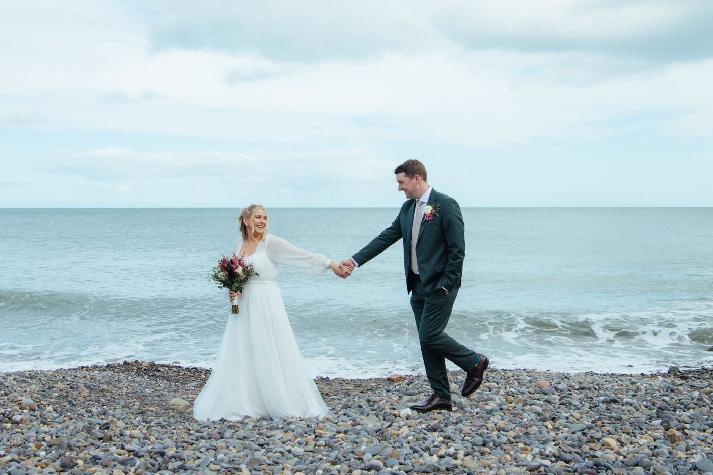 Romantic beach wedding photo captured by Irish wedding photographer.