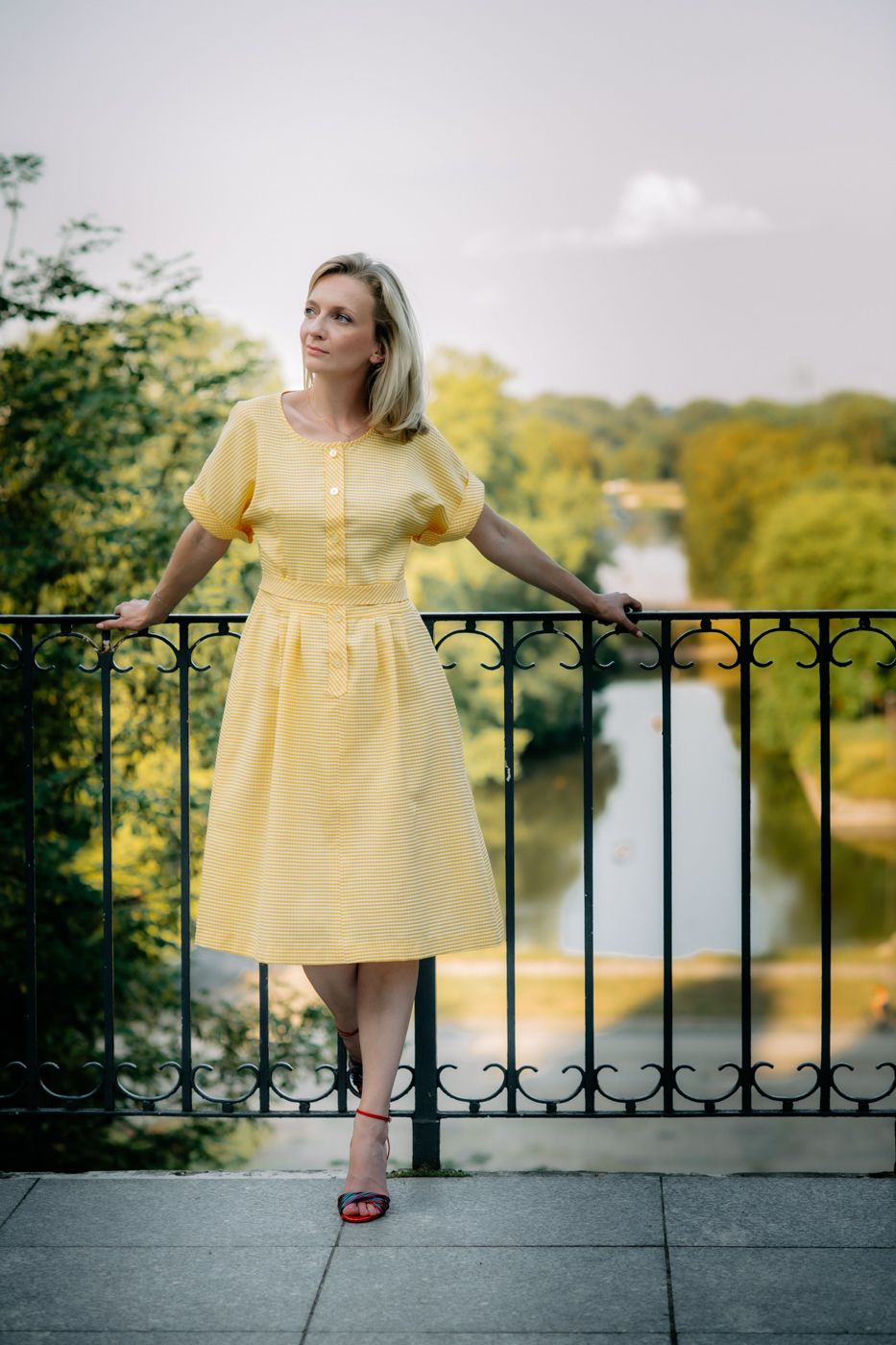Her relaxed posture and the warm tones of her outfit exude a sense of peace and quiet contemplation.