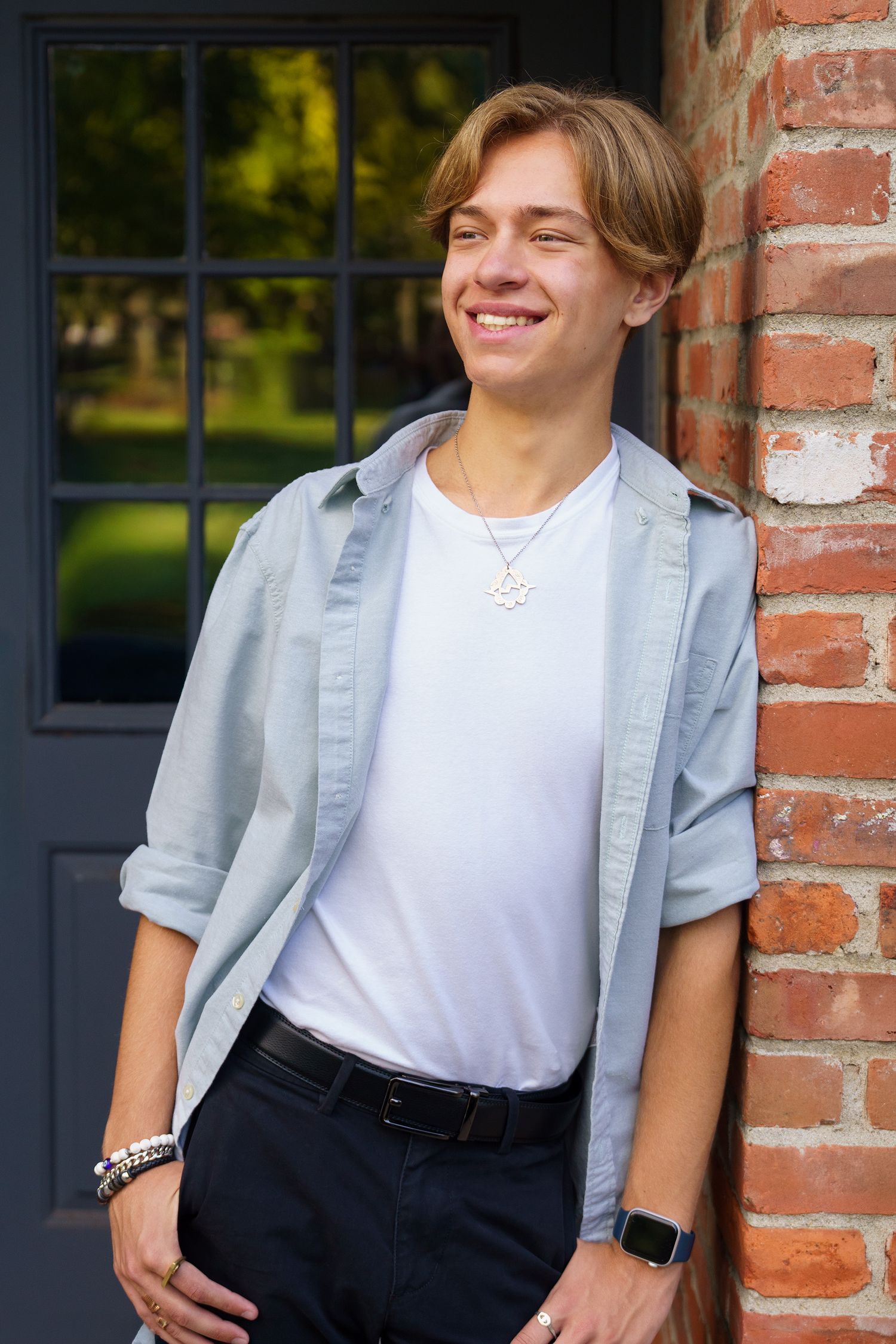 High school senior boy posing in an urban setting in Columbus, Ohio, photographed by Jamie Macey Photography