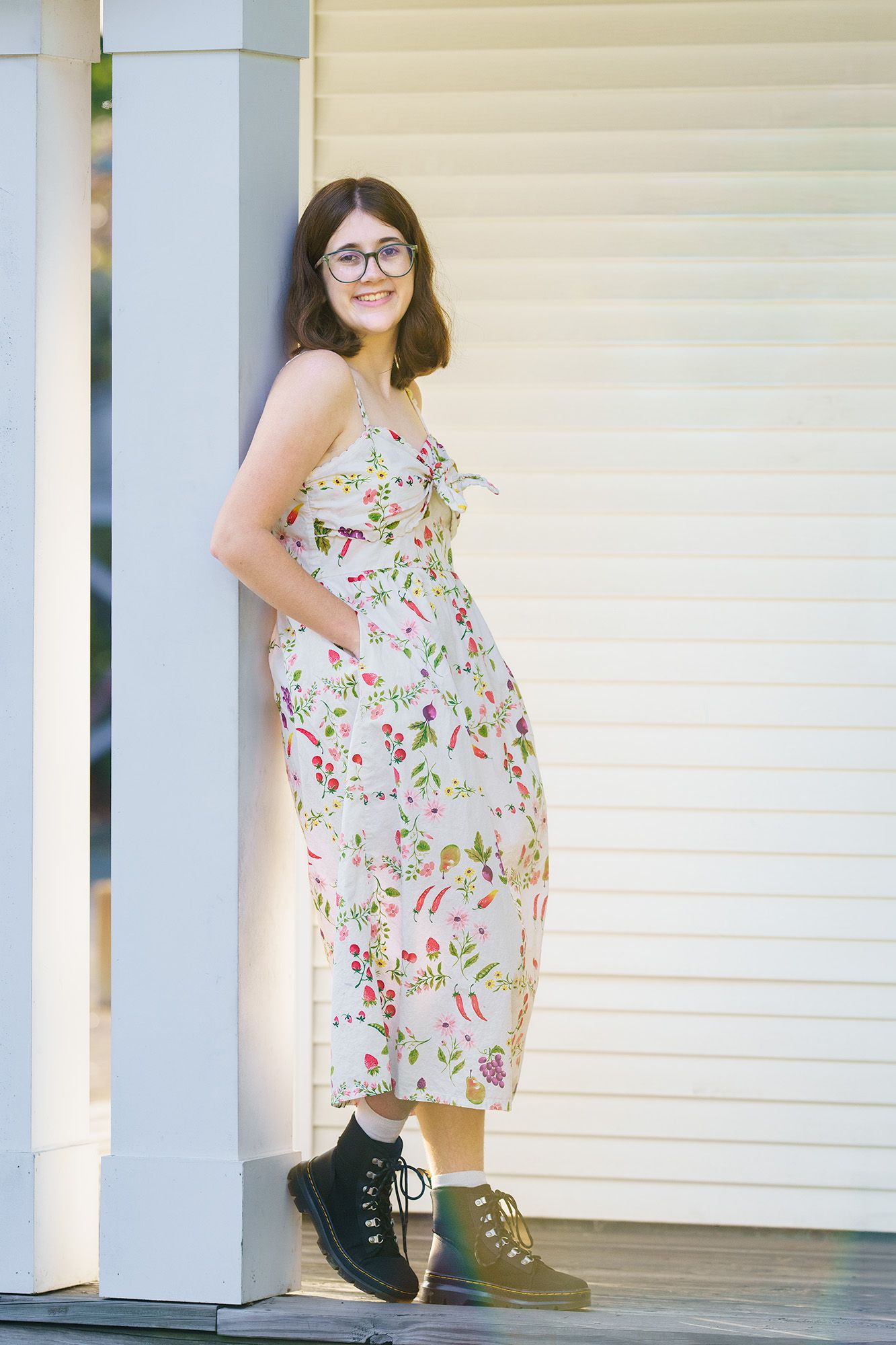 High school senior girl wearing a floral dress at Inniswood Metro Gardens in Columbus, Ohio, photographed by Jamie Macey Photography
