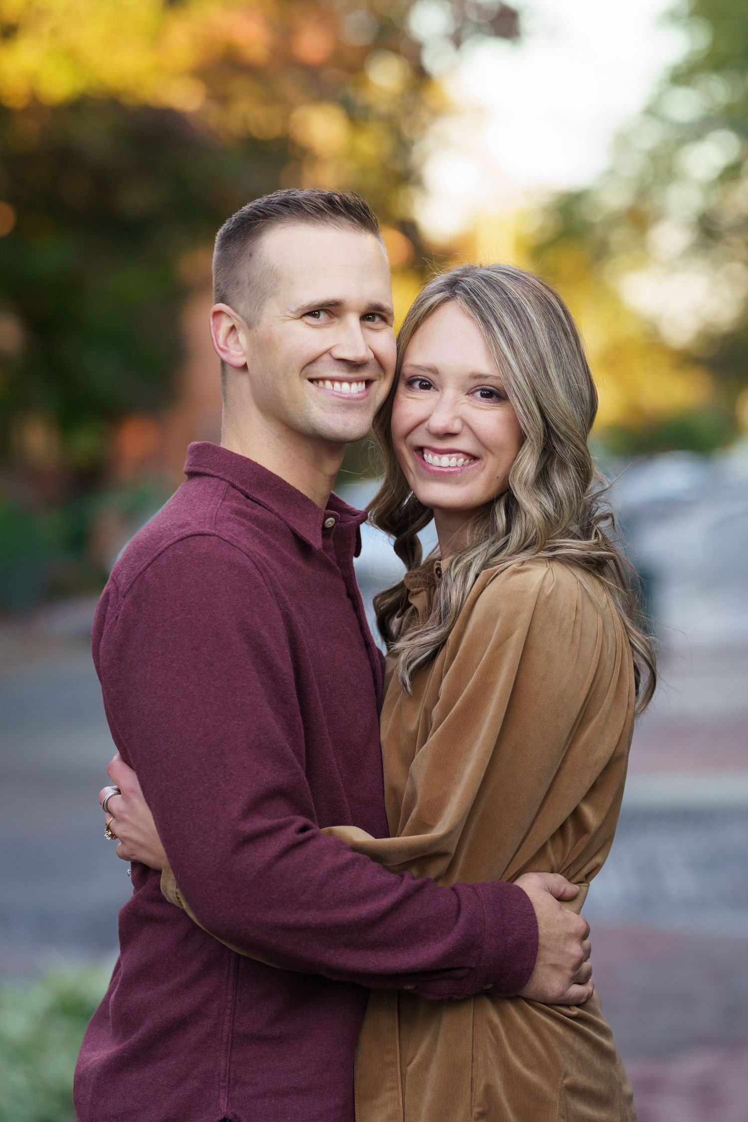 Couple laughing and embracing outdoors in Columbus, Ohio, photographed by Jamie Macey Photography