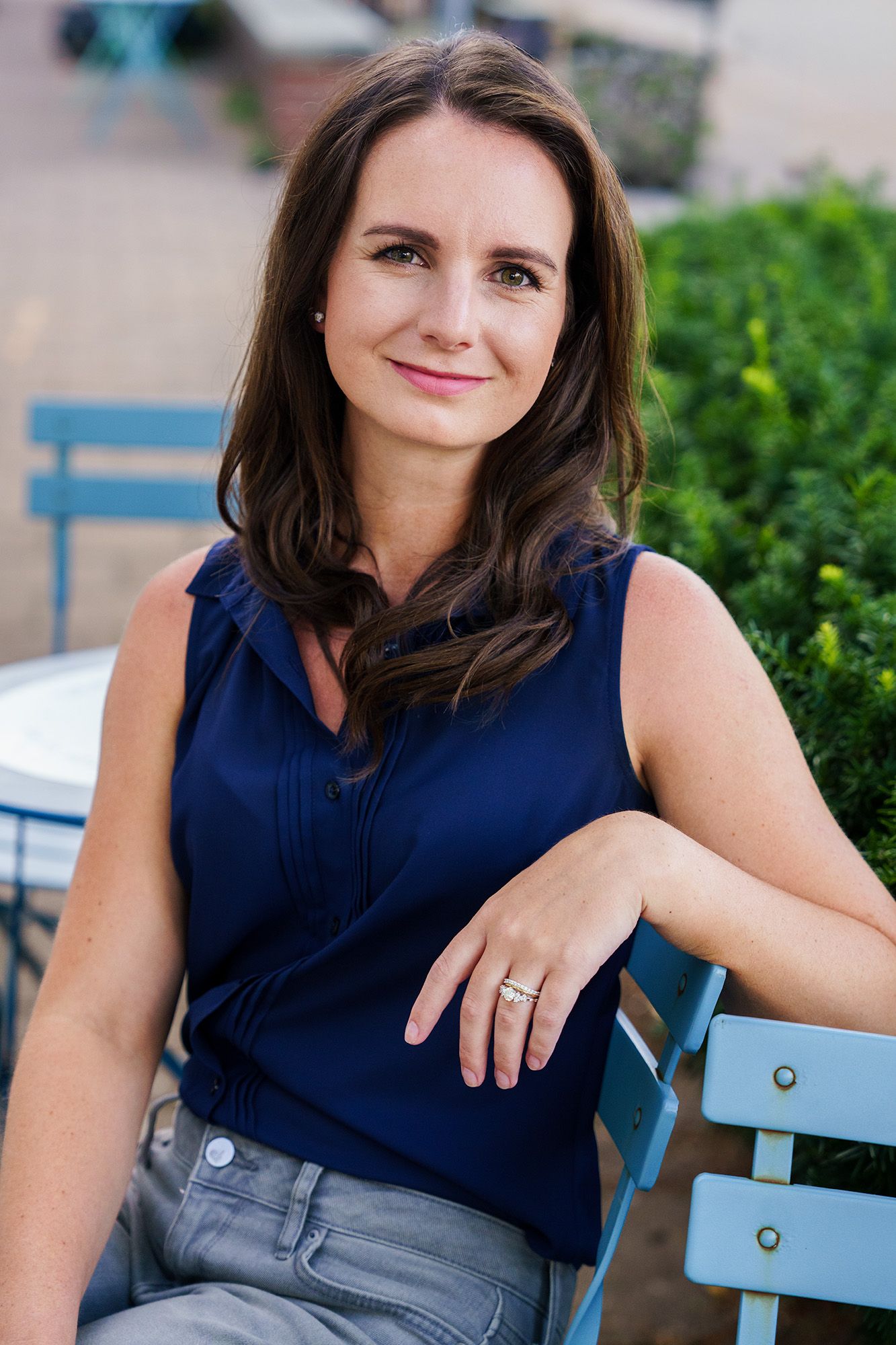 Professional branding portrait of a woman sitting outdoors on a bench during a personal branding session in Columbus, Ohio by Jamie Macey Ph