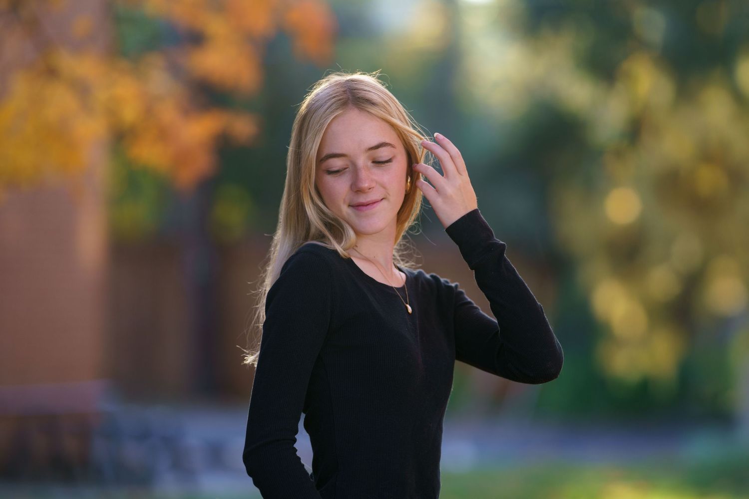 High school senior girl posing outdoors in autumn light in Columbus, Ohio, photographed by Jamie Macey Photography