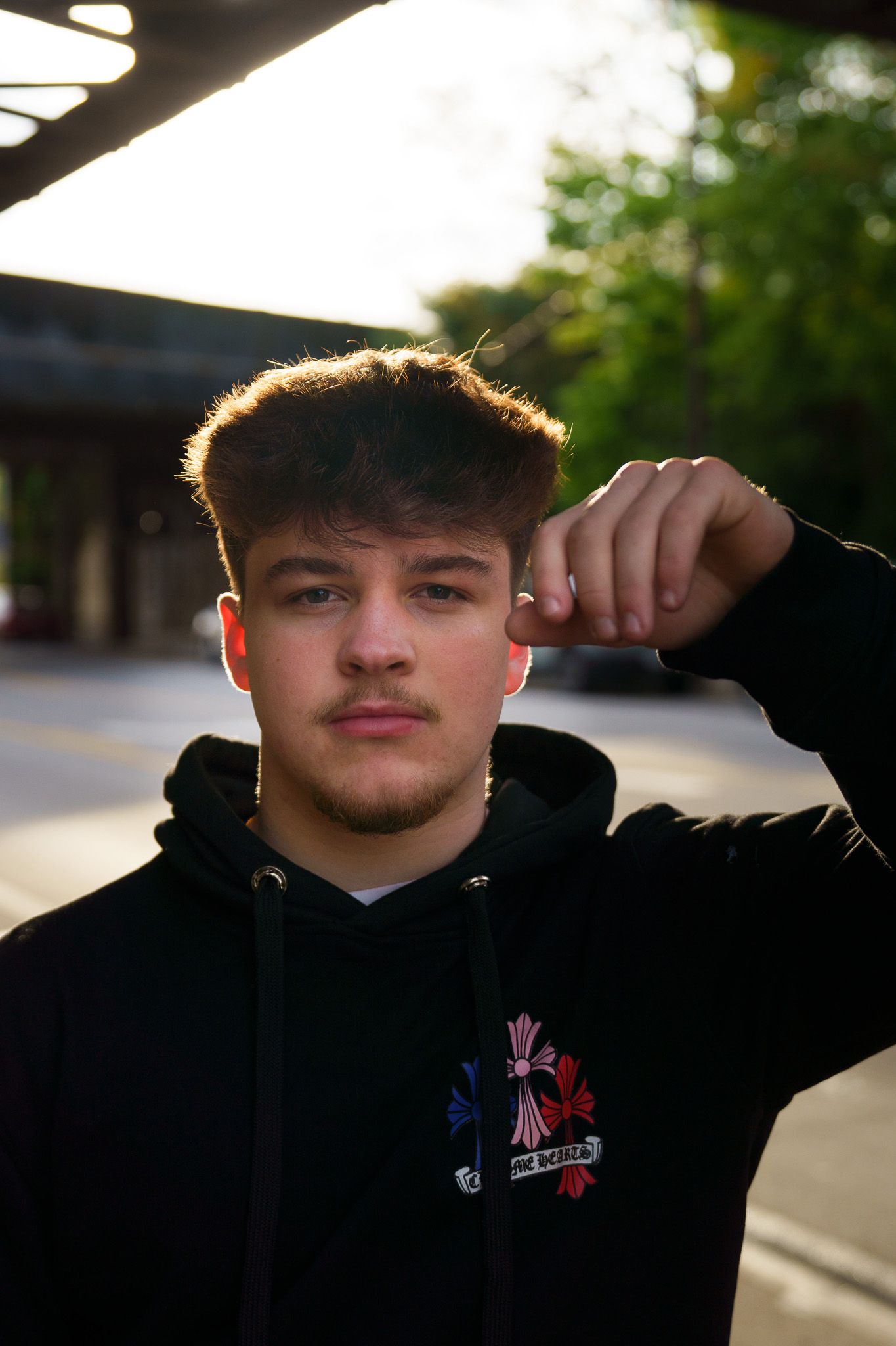 High school senior boy posing outdoors in Columbus, Ohio, photographed by Jamie Macey Photography