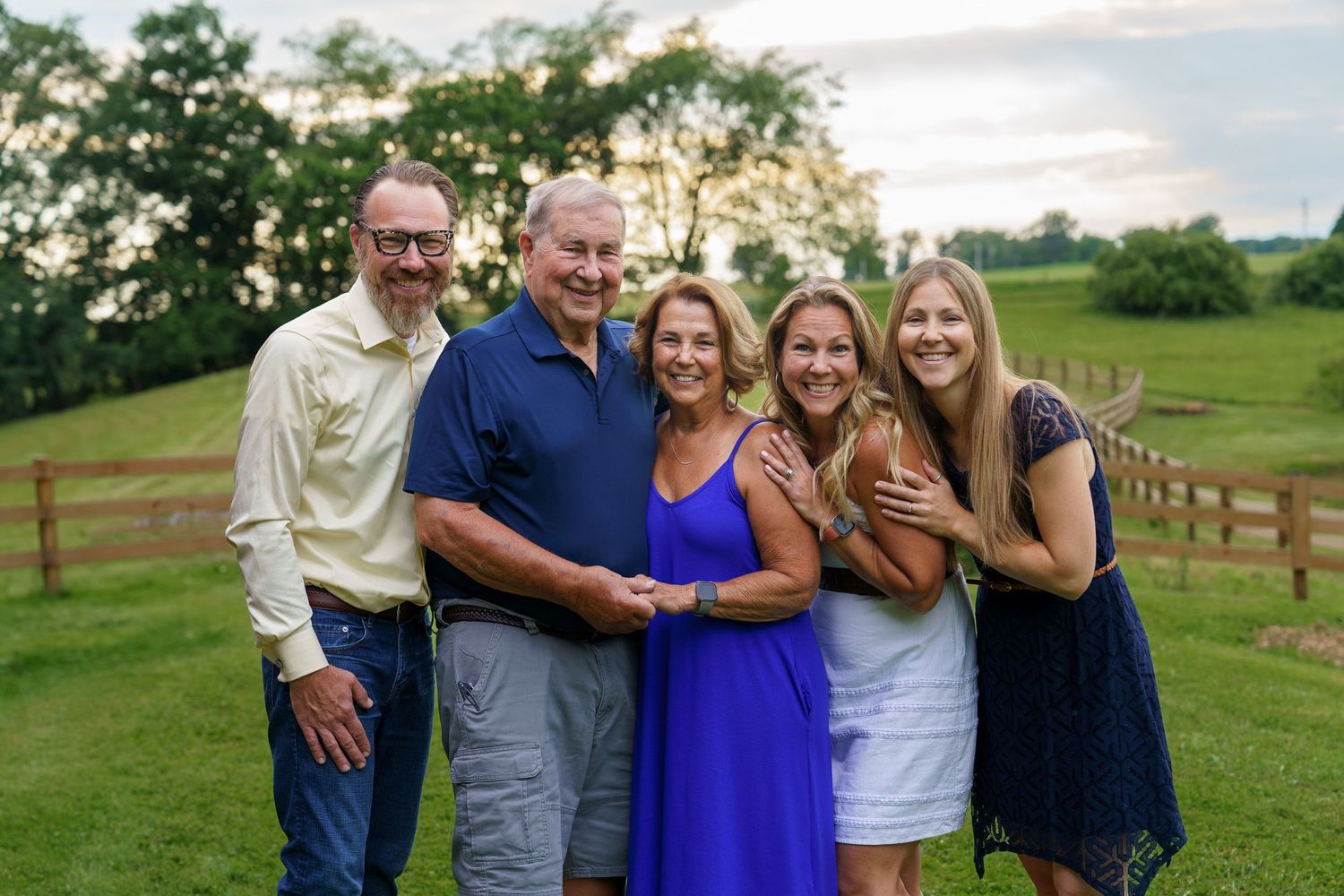 Extended family smiling together outdoors in Columbus, Ohio, photographed by Jamie Macey Photography