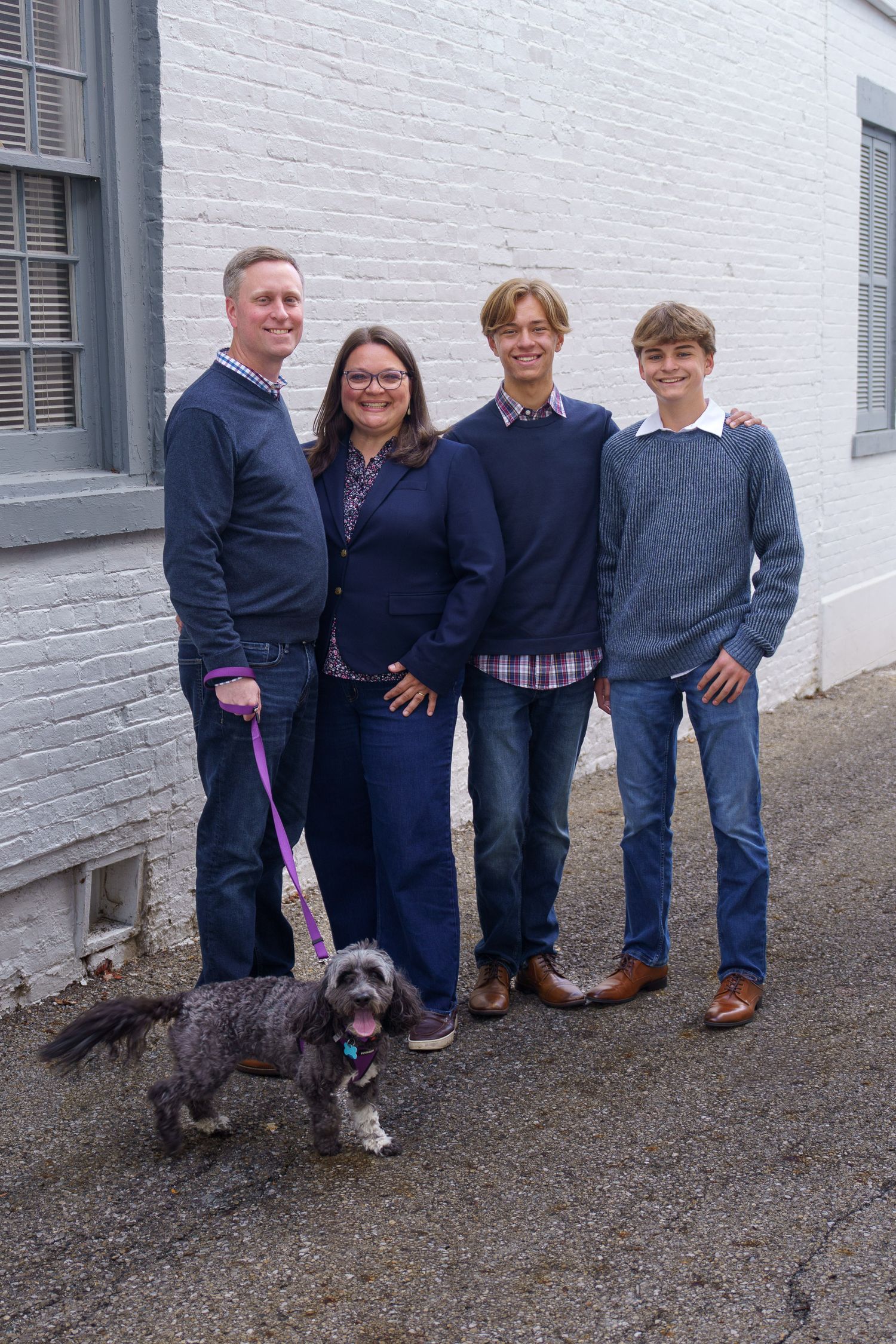 Family standing together outside a historic building in Columbus, Ohio, photographed by Jamie Macey Photography