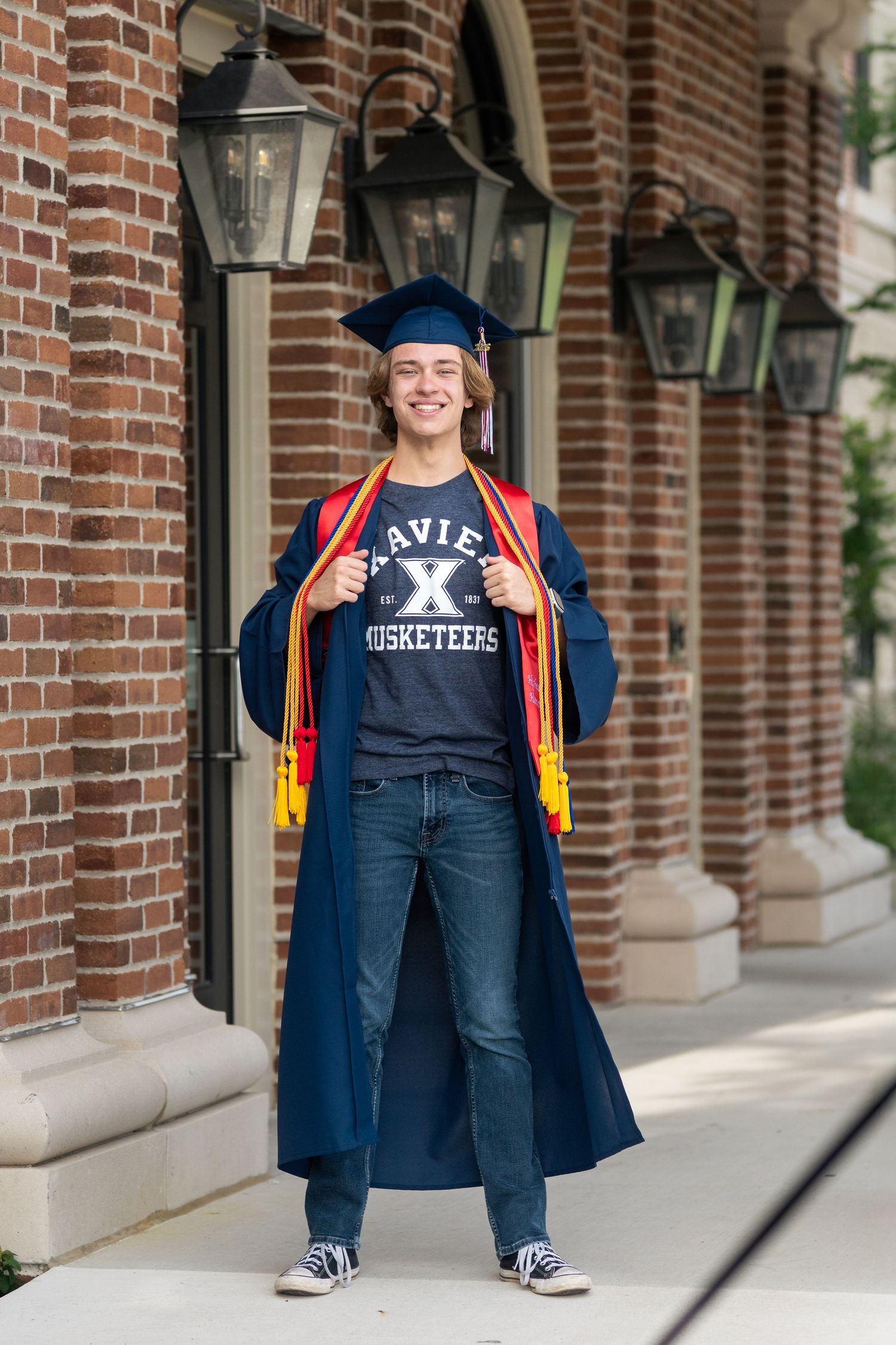 High school graduate wearing a cap and gown in Columbus, Ohio, photographed by Jamie Macey Photography