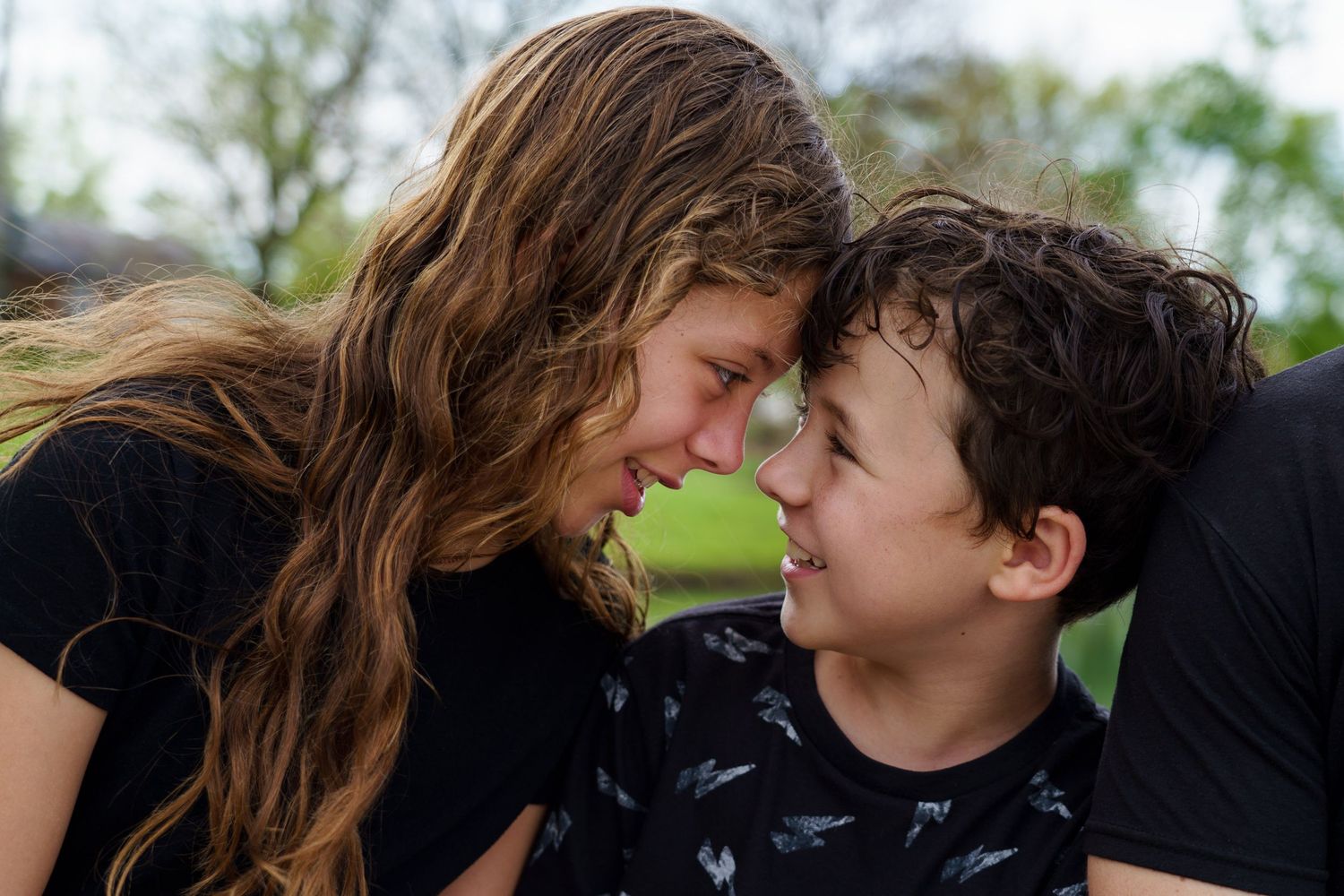 Siblings sharing a playful moment during a family session in Columbus, Ohio, photographed by Jamie Macey Photography