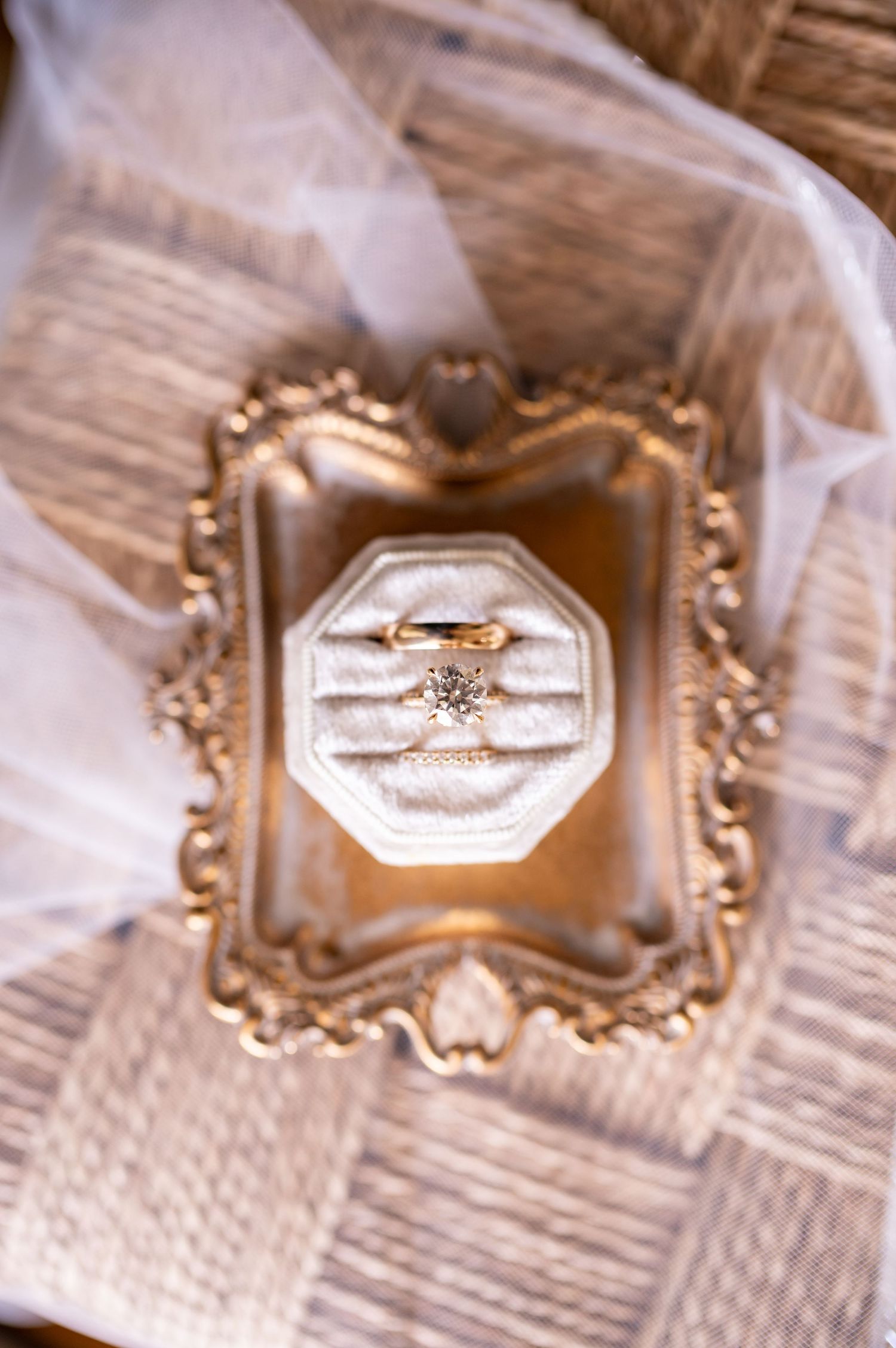 Beautiful engagement ring photographed at different angles in vintage-style frames against a textured white background.